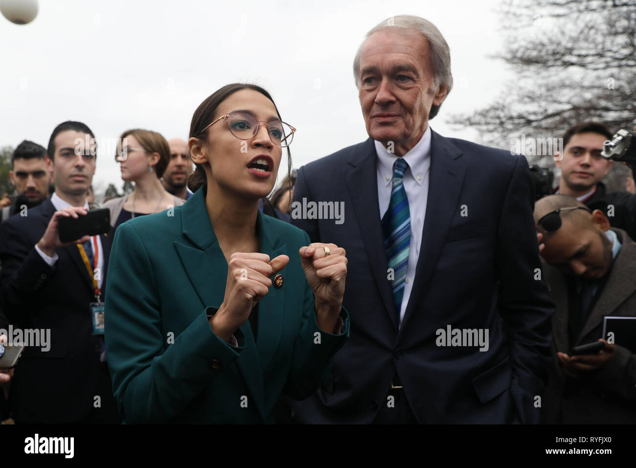 U.S. Rep. Alexandria Ocasio-Cortez, and Senator Ed Markey answers questions during the announcement for the Green New Deal legislation during a press conference outside the Capitol Building February 7, 2019 in Washington, D.C. Stock Photo