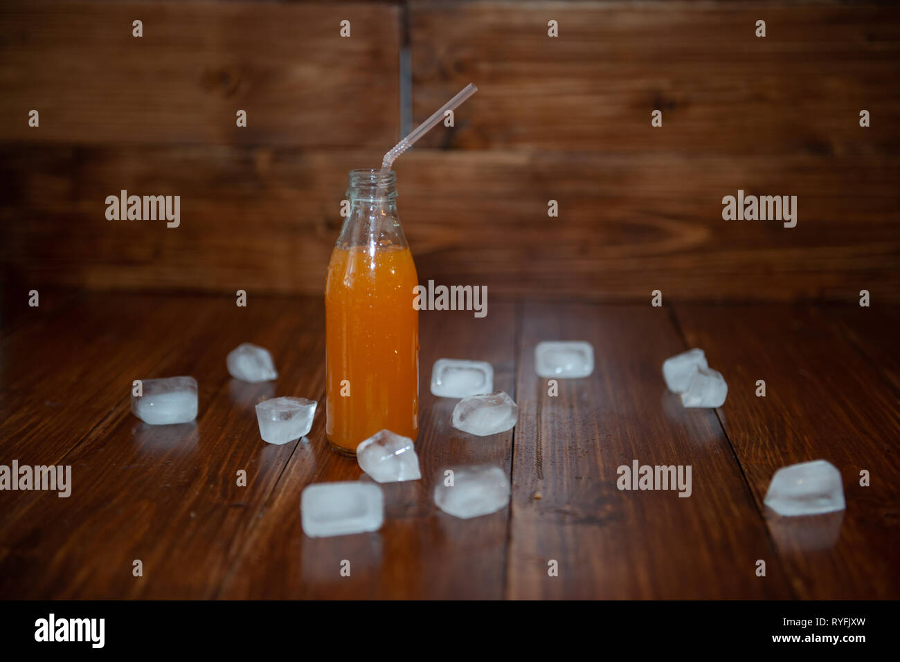 Ice fresh juice with ice cubes on table Stock Photo