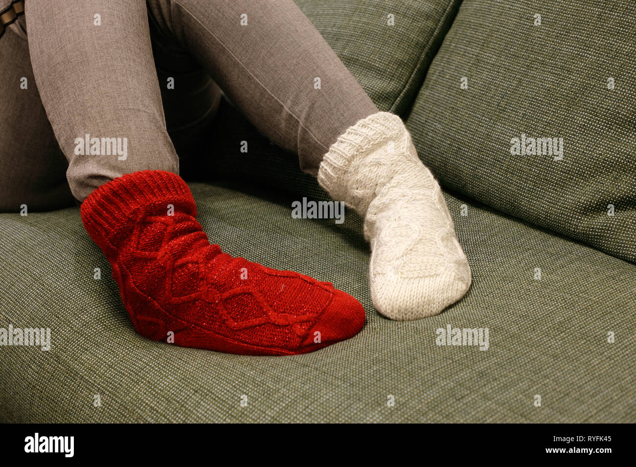 Close up of the feet wearing socks in different color on each foot. Stock Photo