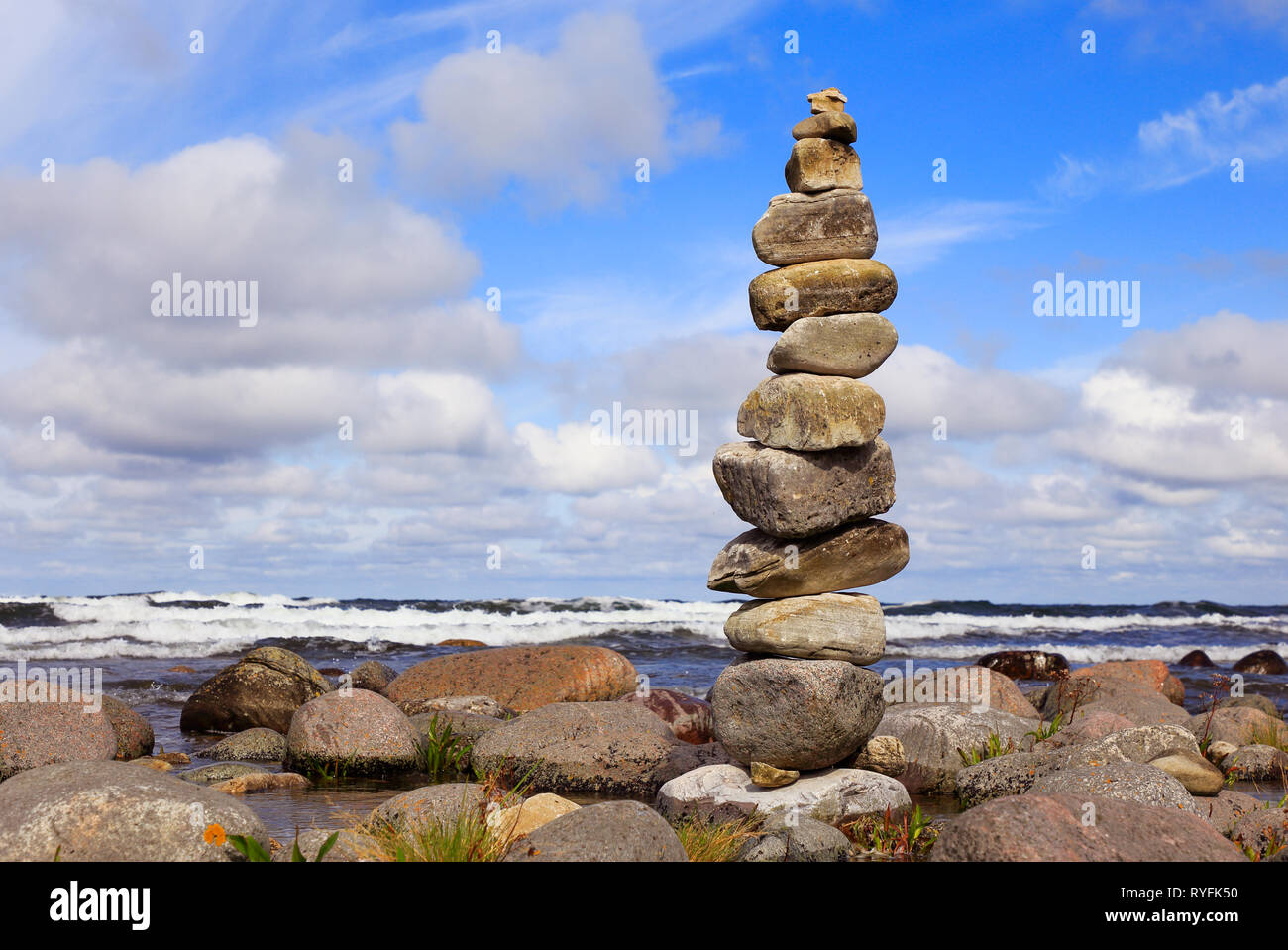 A stone tower at waters edge. Stock Photo