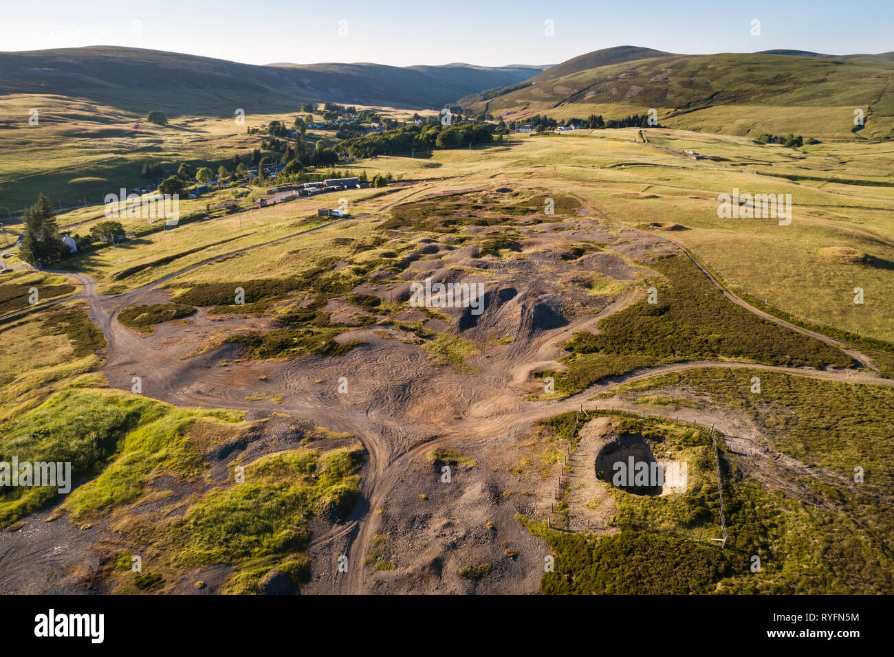 Aerial image of the village of Leadhills, arguably Scotland's highest village, showing historic mining sites and old shafts. Stock Photo