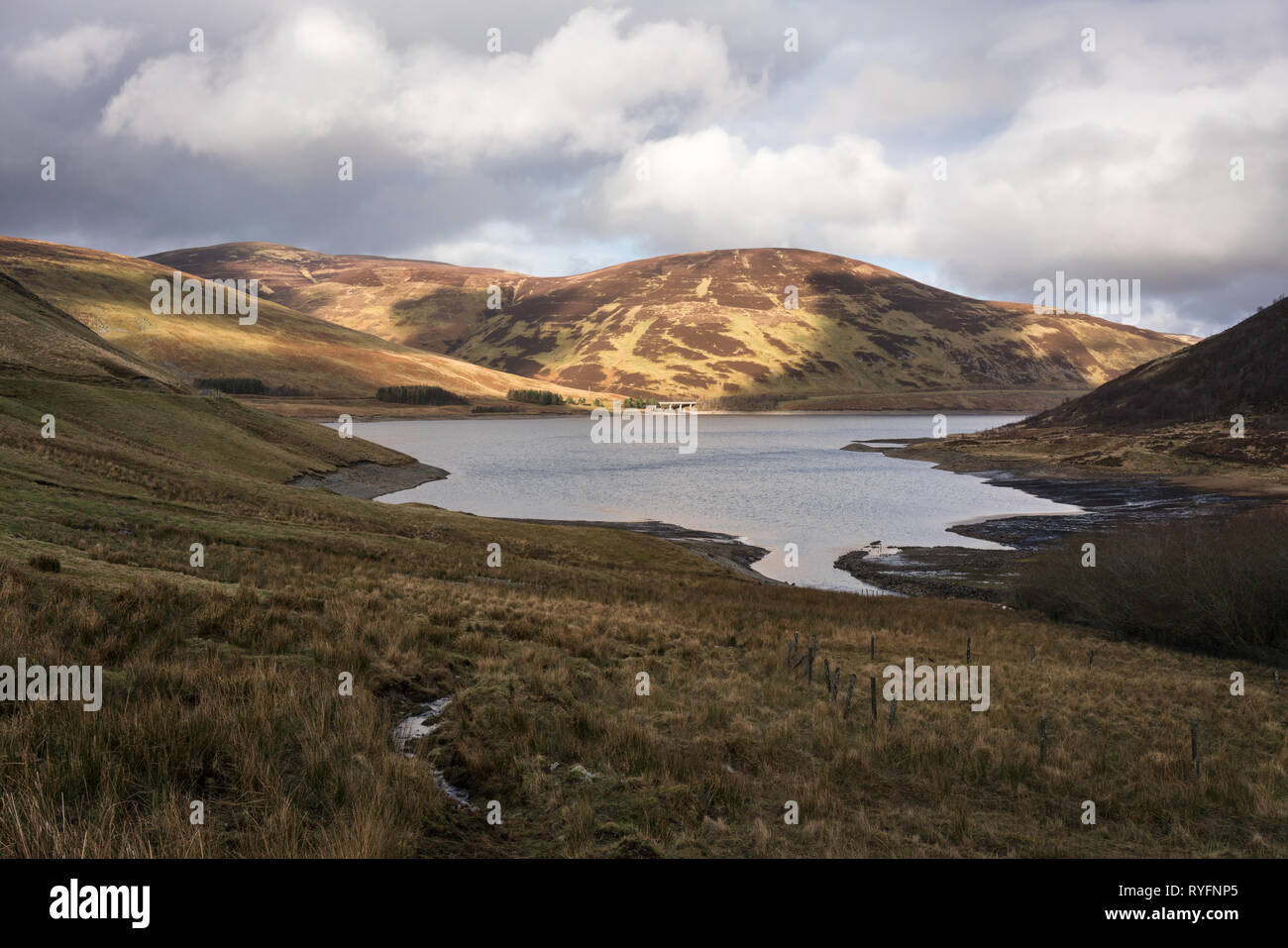 Megget Reservoir seen from Winterhope on a dramatic winter afternoon. Stock Photo