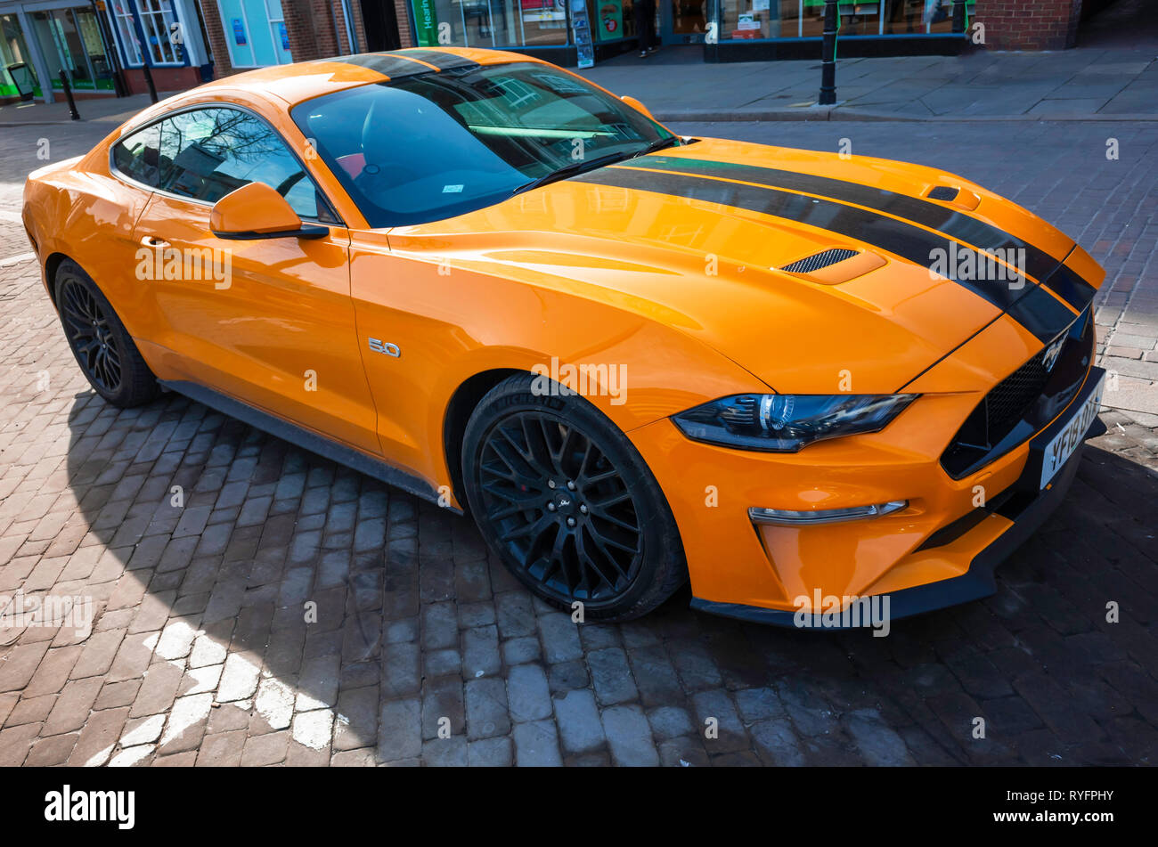 A 2018 registered orange and black Ford Mustang 5.0 sports  car in North Yorkshire England UK Stock Photo