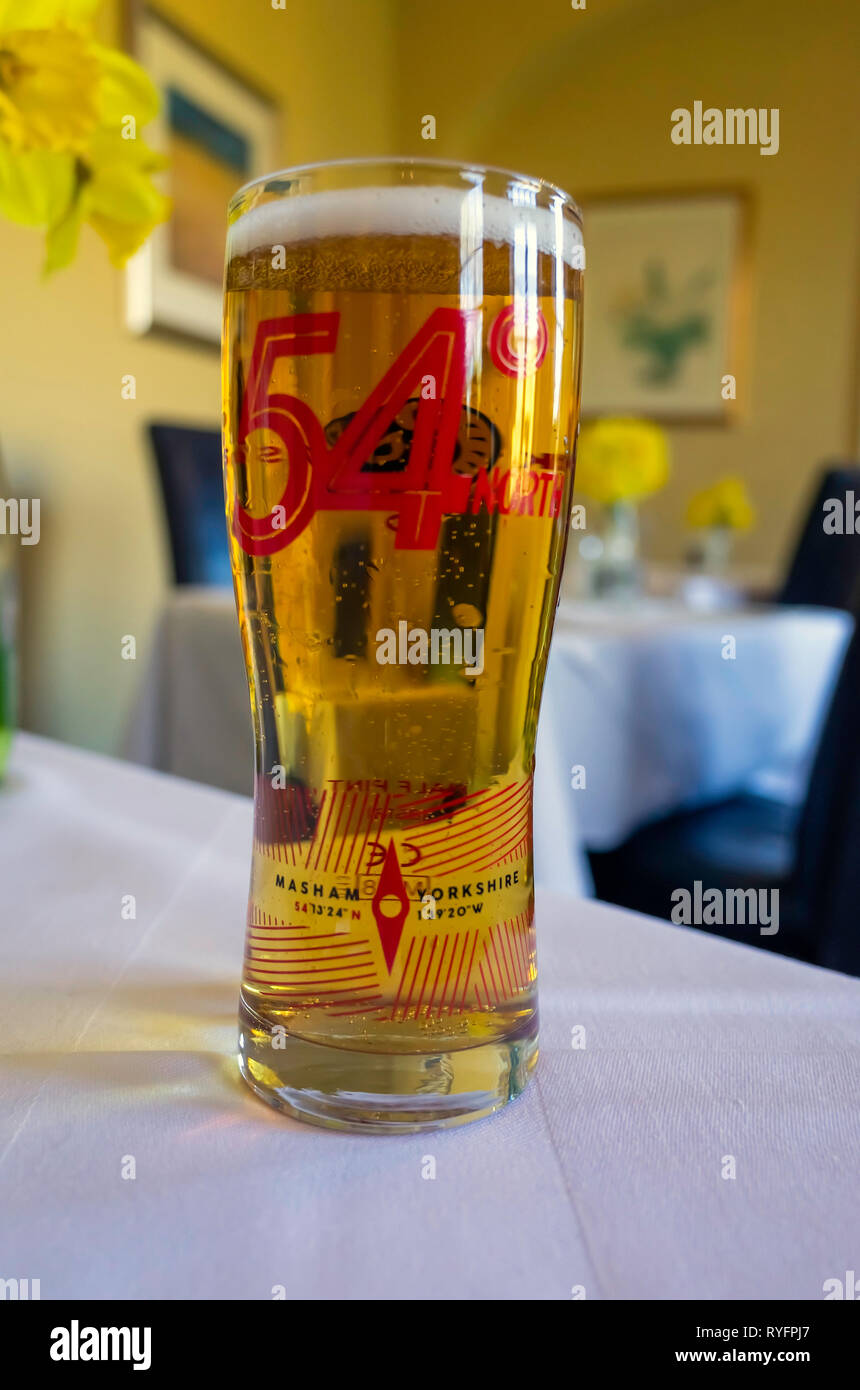 A glass of 54o North Small Batch Lager beer brewed at the Black Sheep Brewery in Masham North Yorkshire England Stock Photo