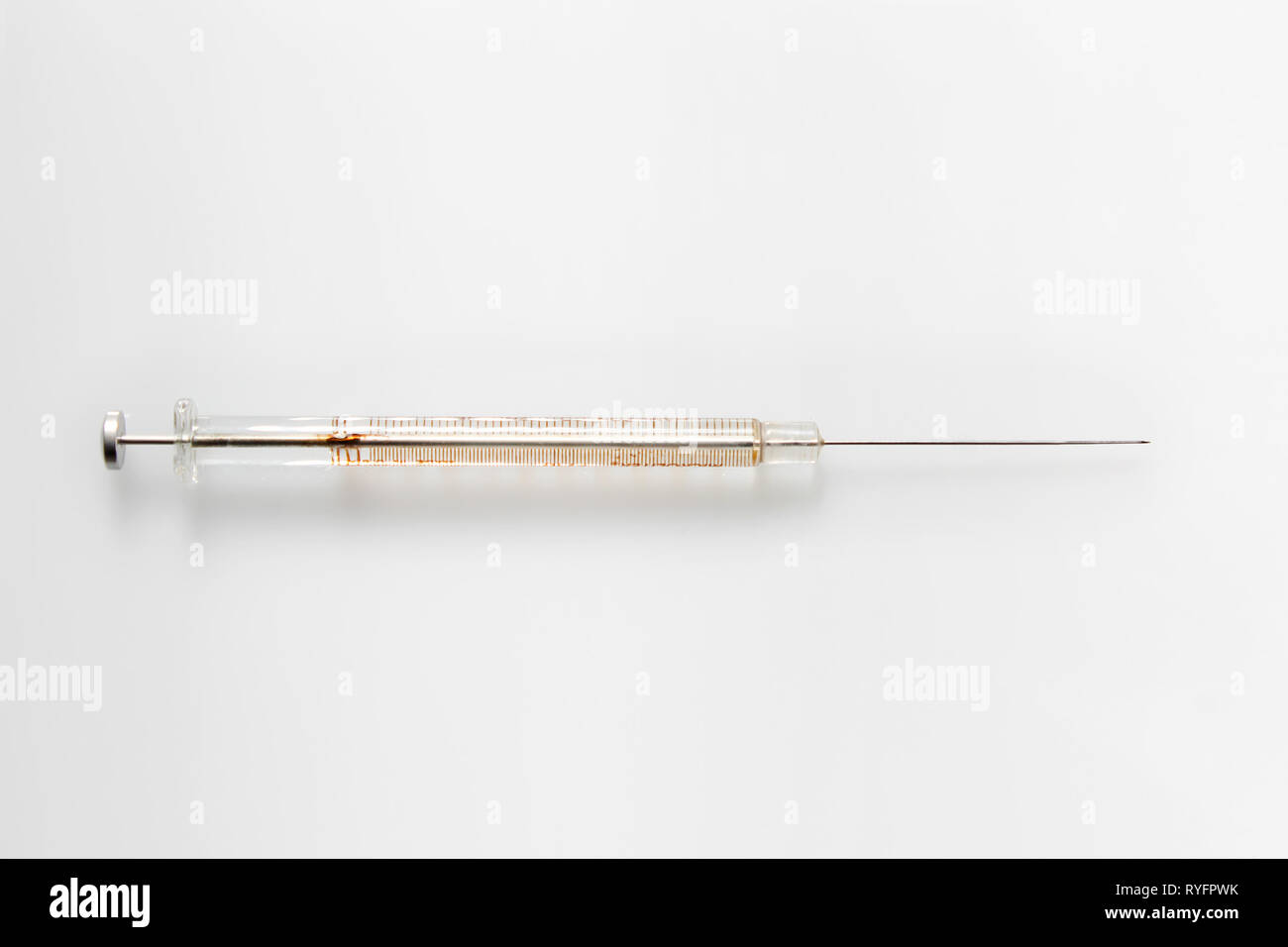 Vintage glass syringe, isolated on white background, close-up Stock Photo