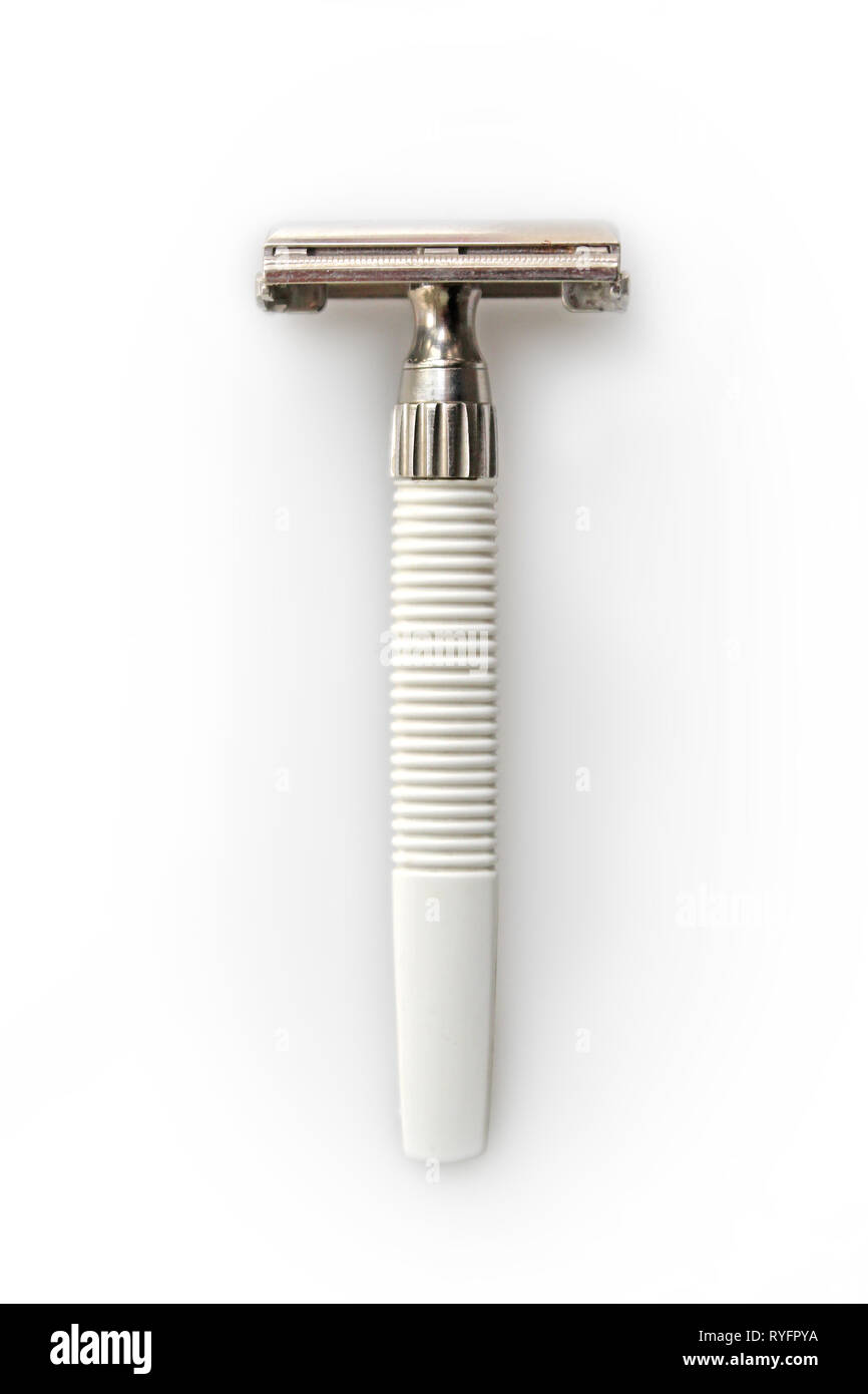 Vintage 60s-70s gillette safety razor shaver with white plastic handle, isolated on a white background, close-up Stock Photo