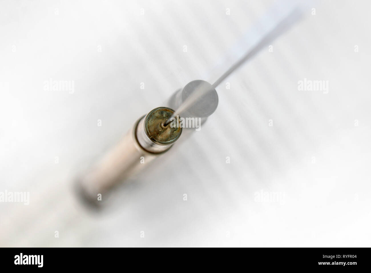 Vintage glass syringe, isolated on white background, close-up Stock Photo