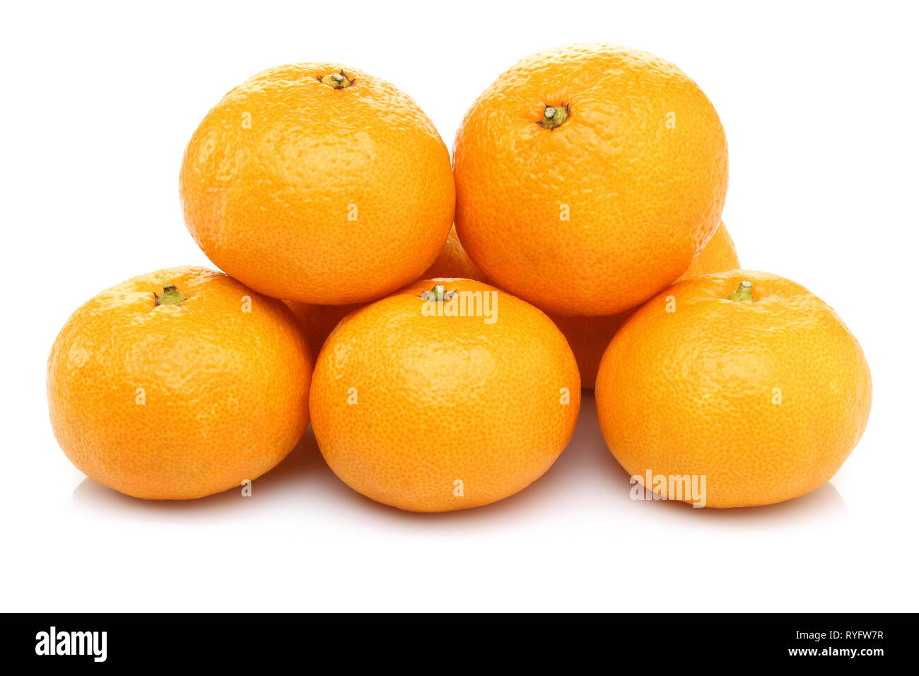 Heap of whole mandarin fruits isolated on white background Stock Photo