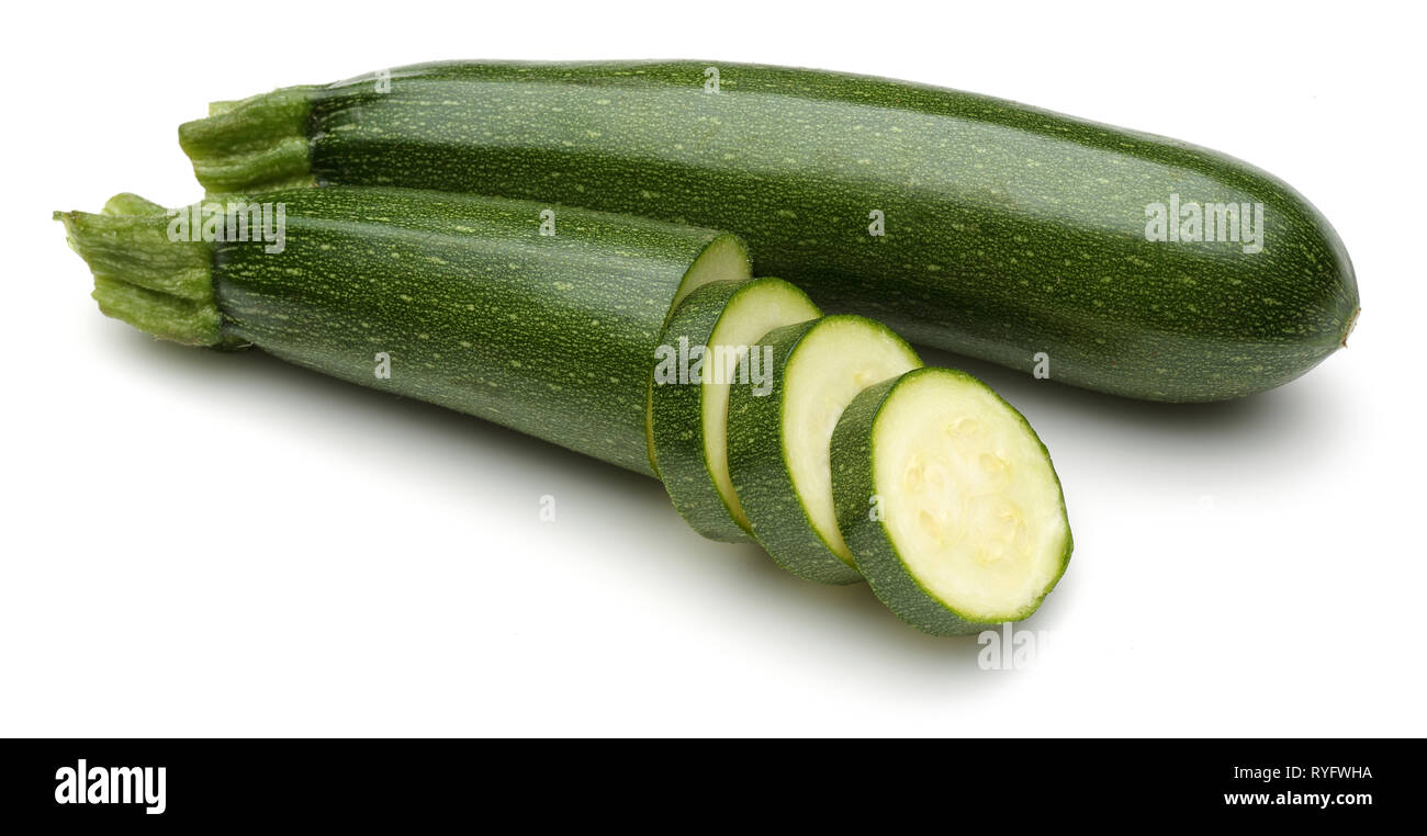 Green zucchini with slices isolated on white background Stock Photo