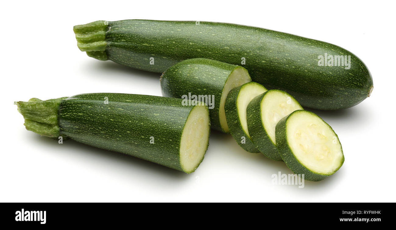 Green zucchini with slices isolated on white background Stock Photo