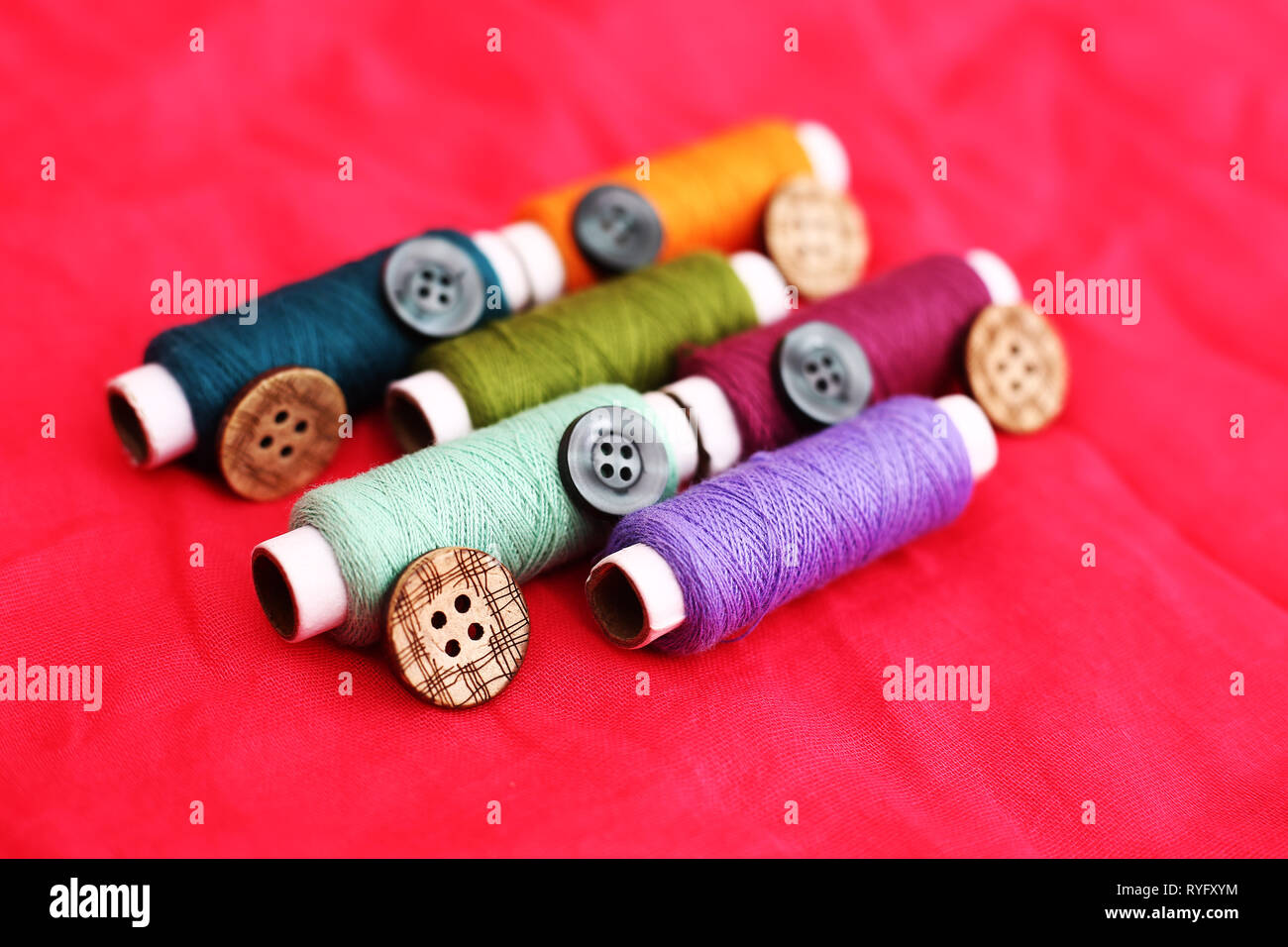 Sewing thread on white background hi-res stock photography and