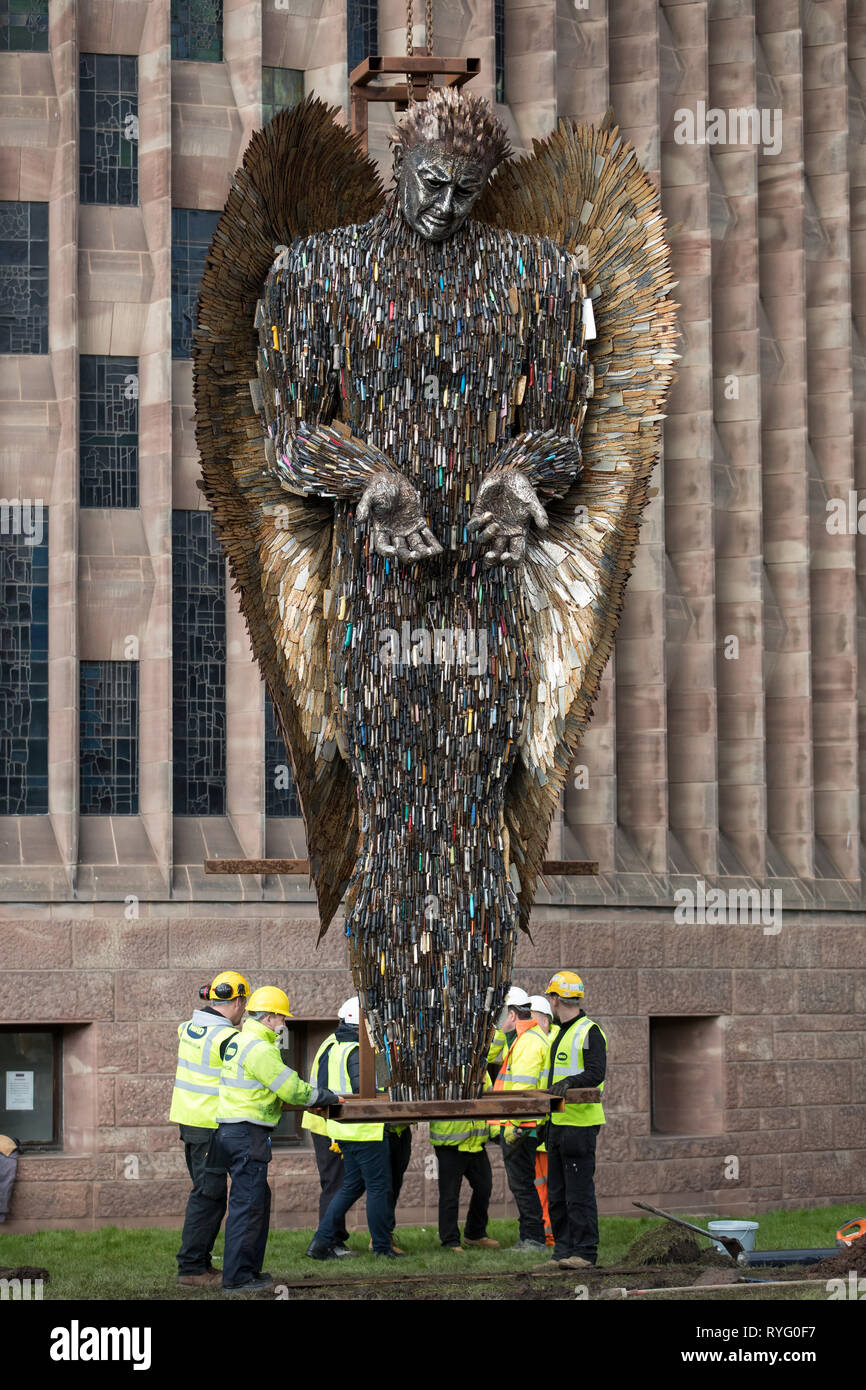 A Knife Angel sculpture, made of 100,000 confiscated knives, is installed at Coventry Cathedral. The 27-foot high artwork, created by artist Alfie Bradley, starts its residence at the cathedral until April 23 'as a physical reminder of the effects of violence and aggression'. Coventry Cathedral, Priory Street, Coventry. Stock Photo