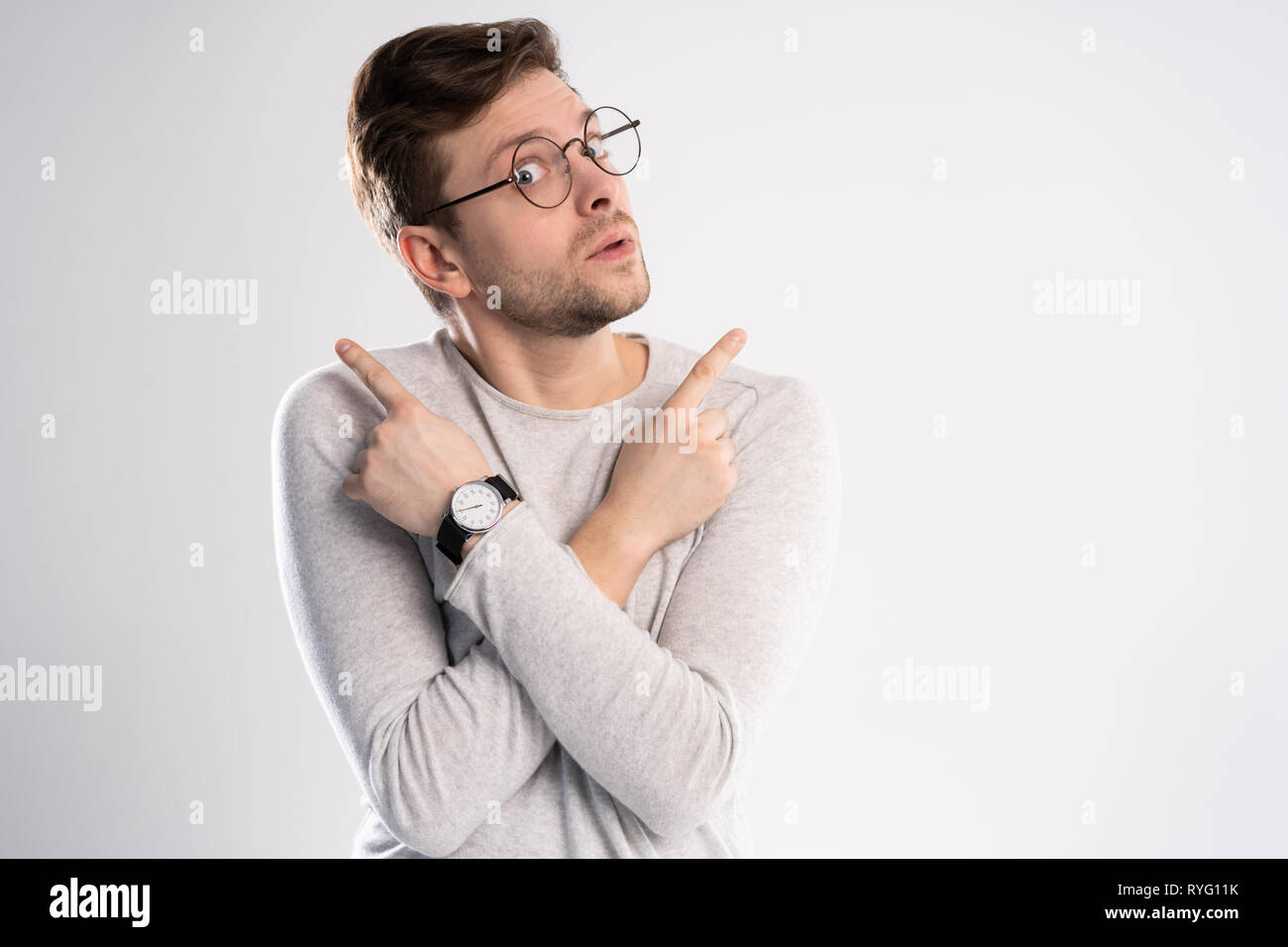 Young emotional careless man isolated on white background with copy ...