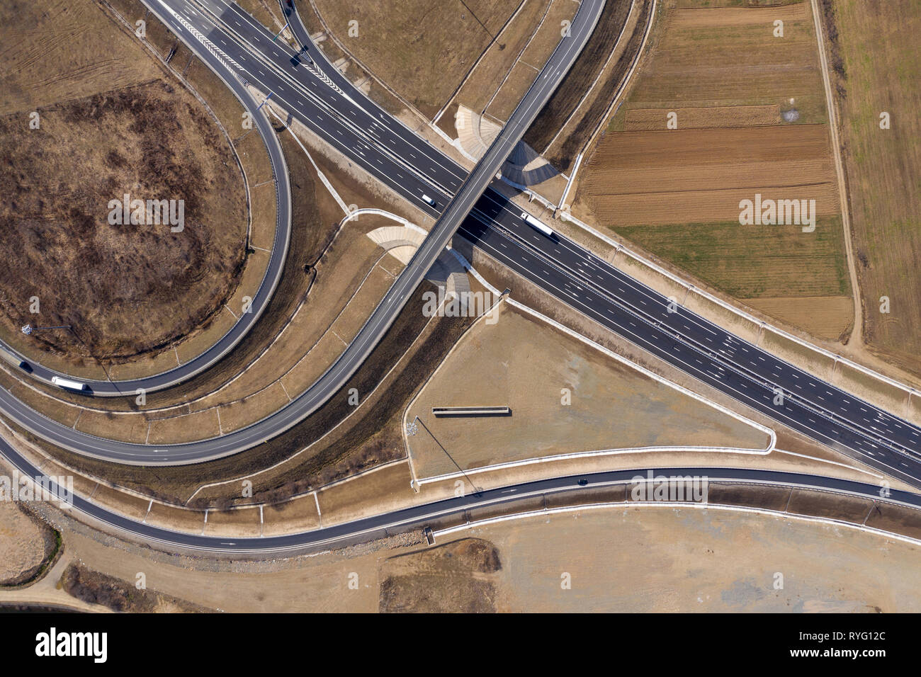 Flying above cars and trucks on a bustling highway, aerial drone shot Stock Photo