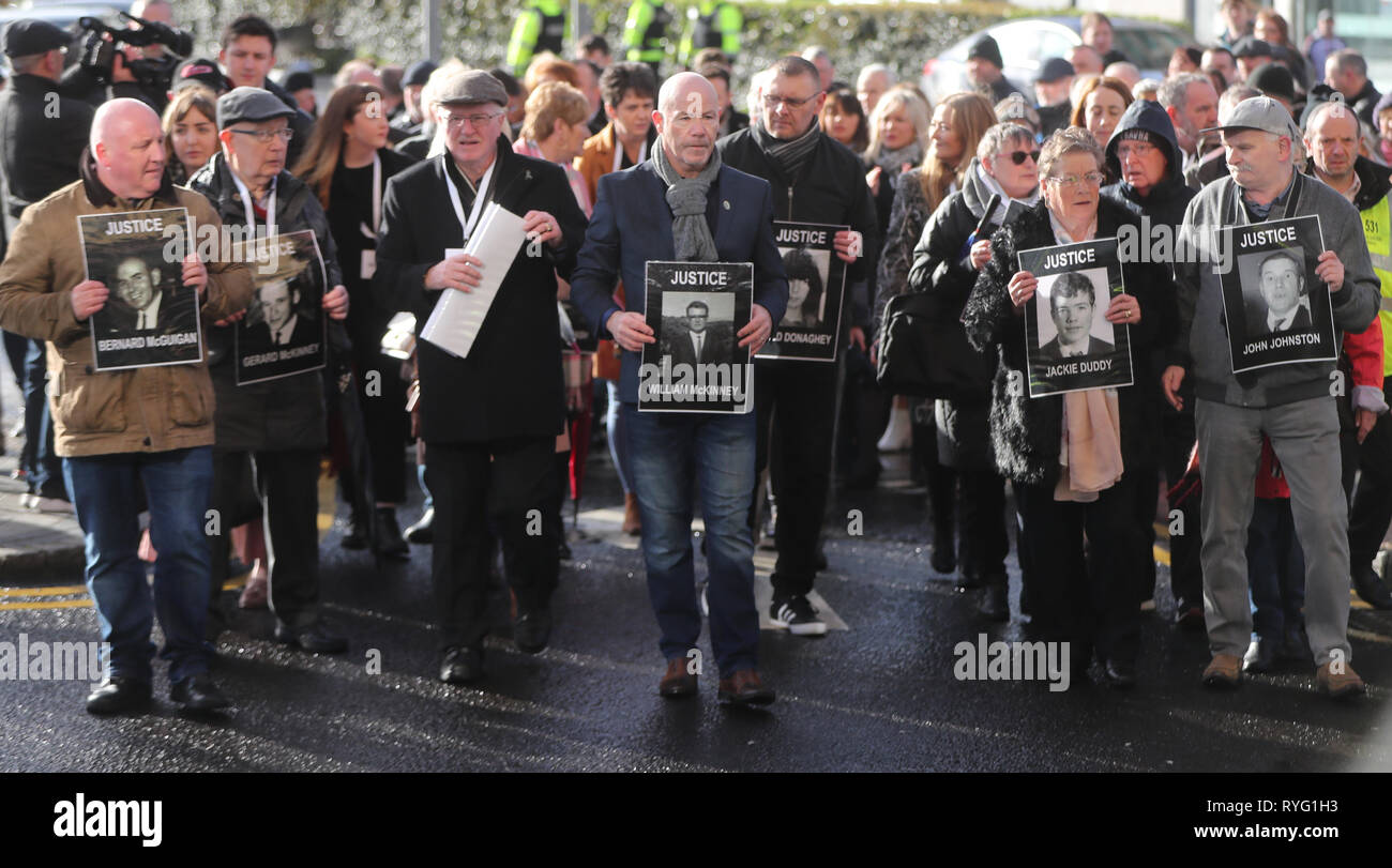 Relatives of those who died march to the Guildhall in Londonderry, Northern Ireland, after the announcement from the Public Prosecution Service that one former paratrooper, soldier F is to be charged with two murders and four attempted murders during Bloody Sunday in Londonderry in 1972. Stock Photo