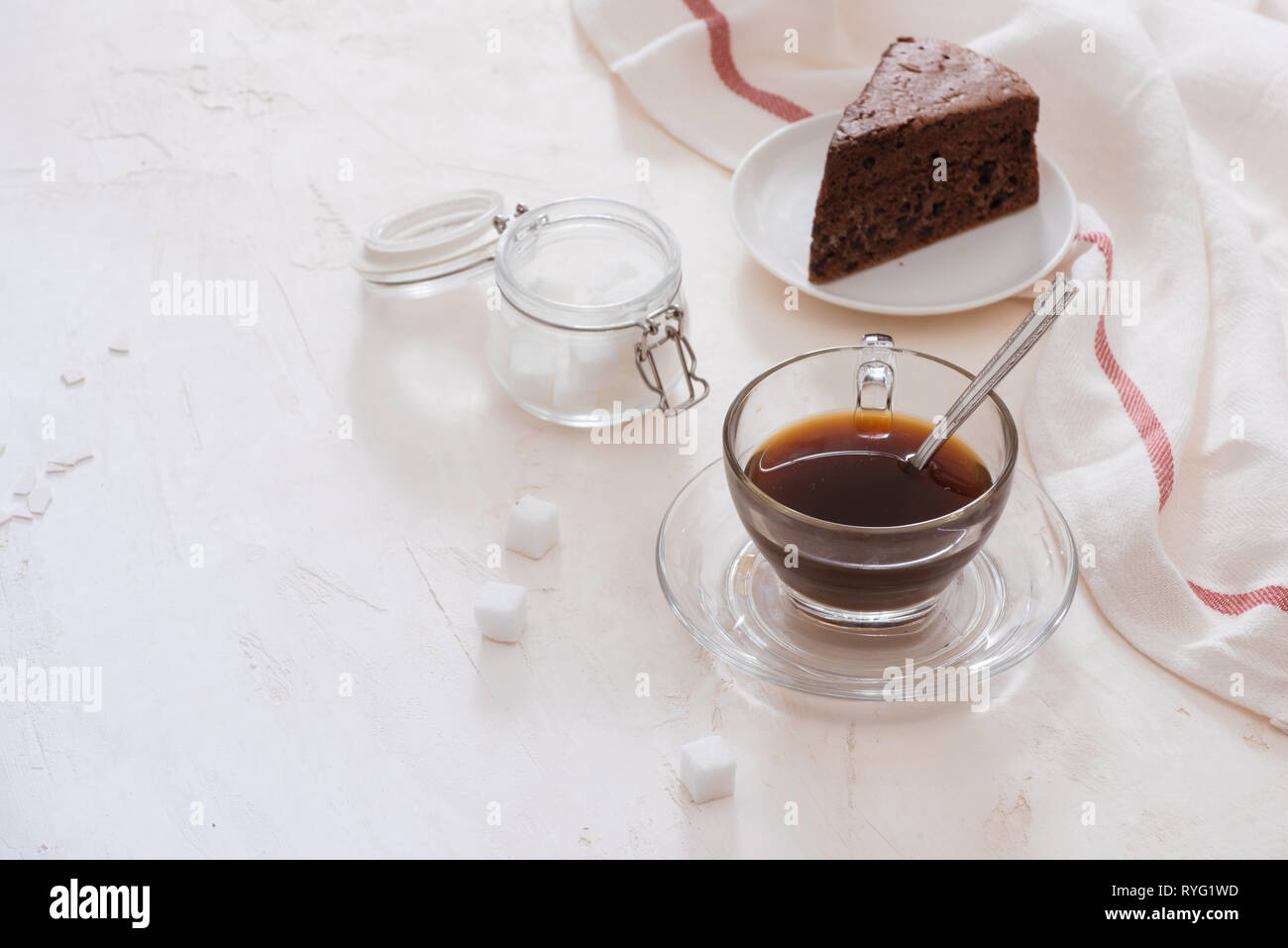 Drip coffee (dripper) and drip ground coffee with glass drip pot, cup and chocolate cake Stock Photo