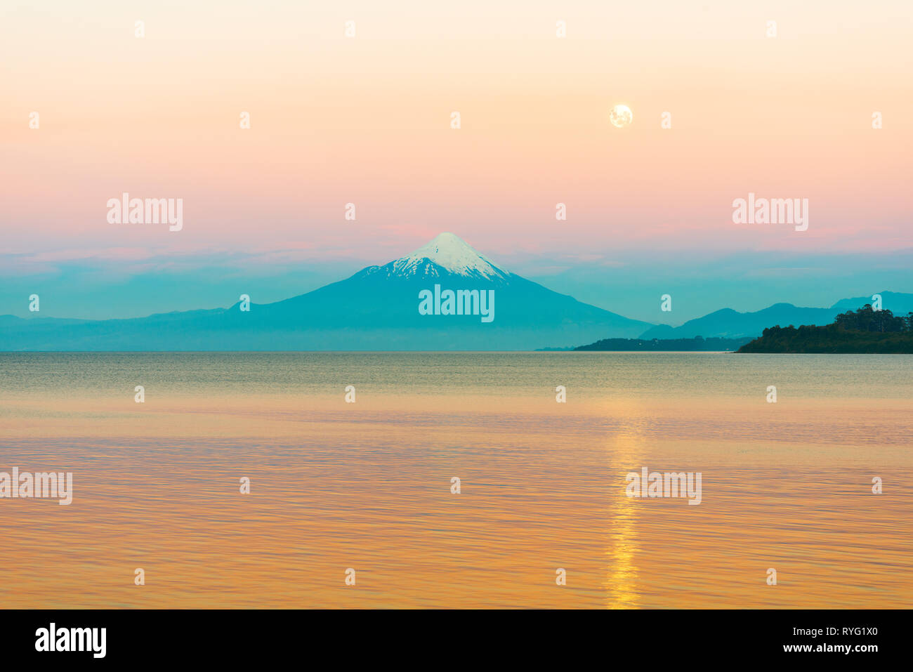 Moon rising over Lake LLanquihue and Osorno Volcano, X Region de Los Lagos, Chile Stock Photo