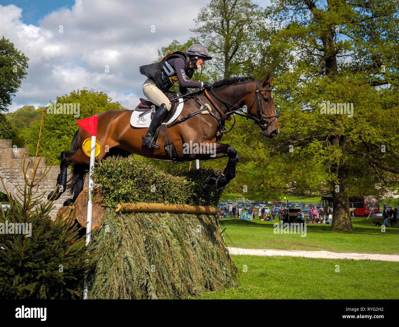Horse and rider jumping over obstacle Chatsworth Horse trials