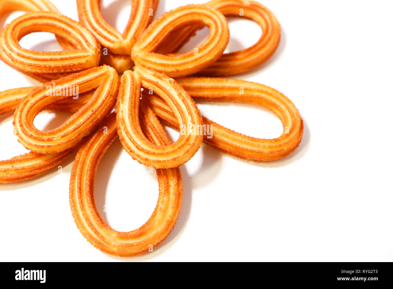 Spanish Fritters In Flower Shape On White Background Stock Photo
