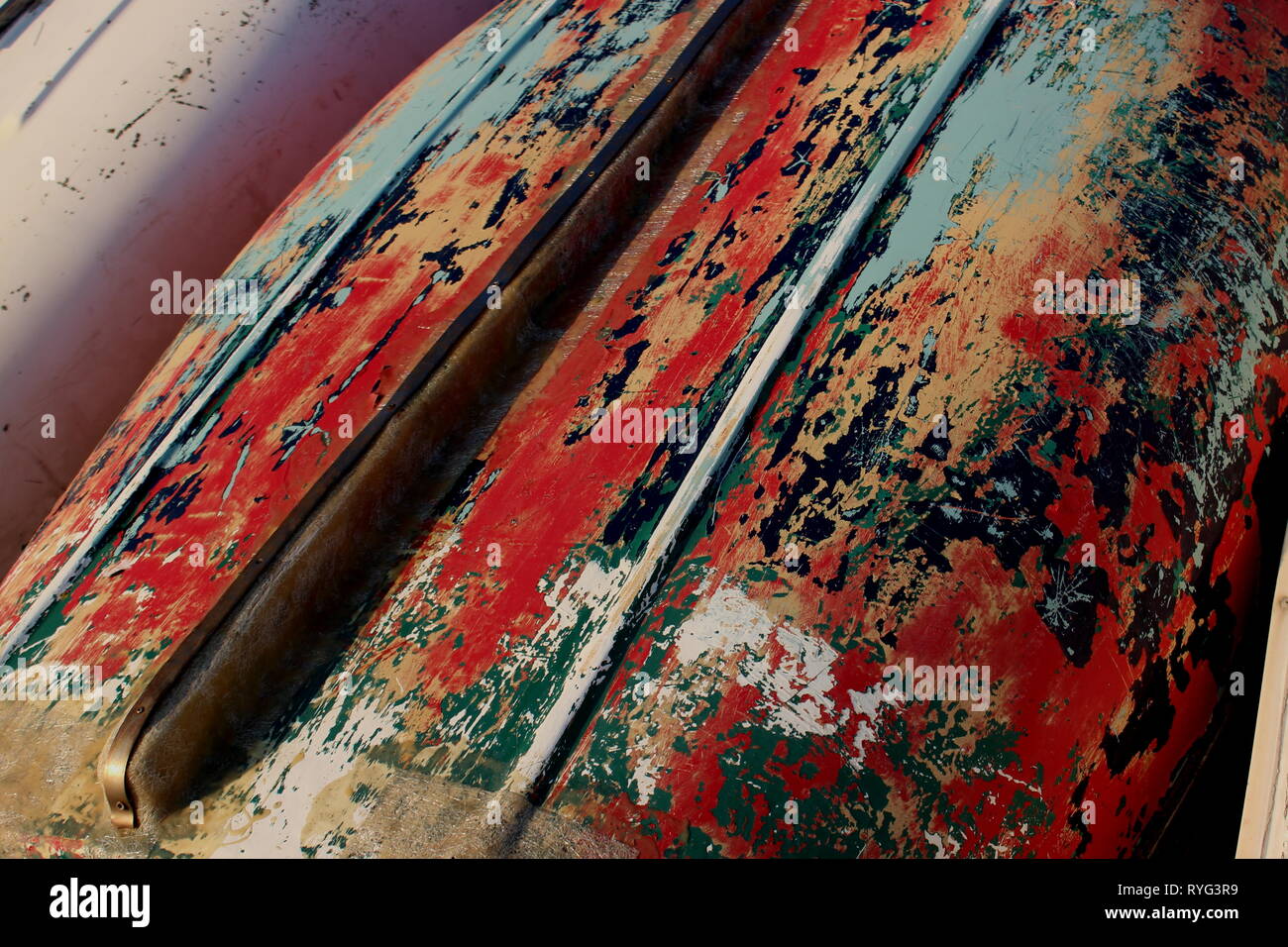 an abstract colour image showing the underside of a boat hull that has