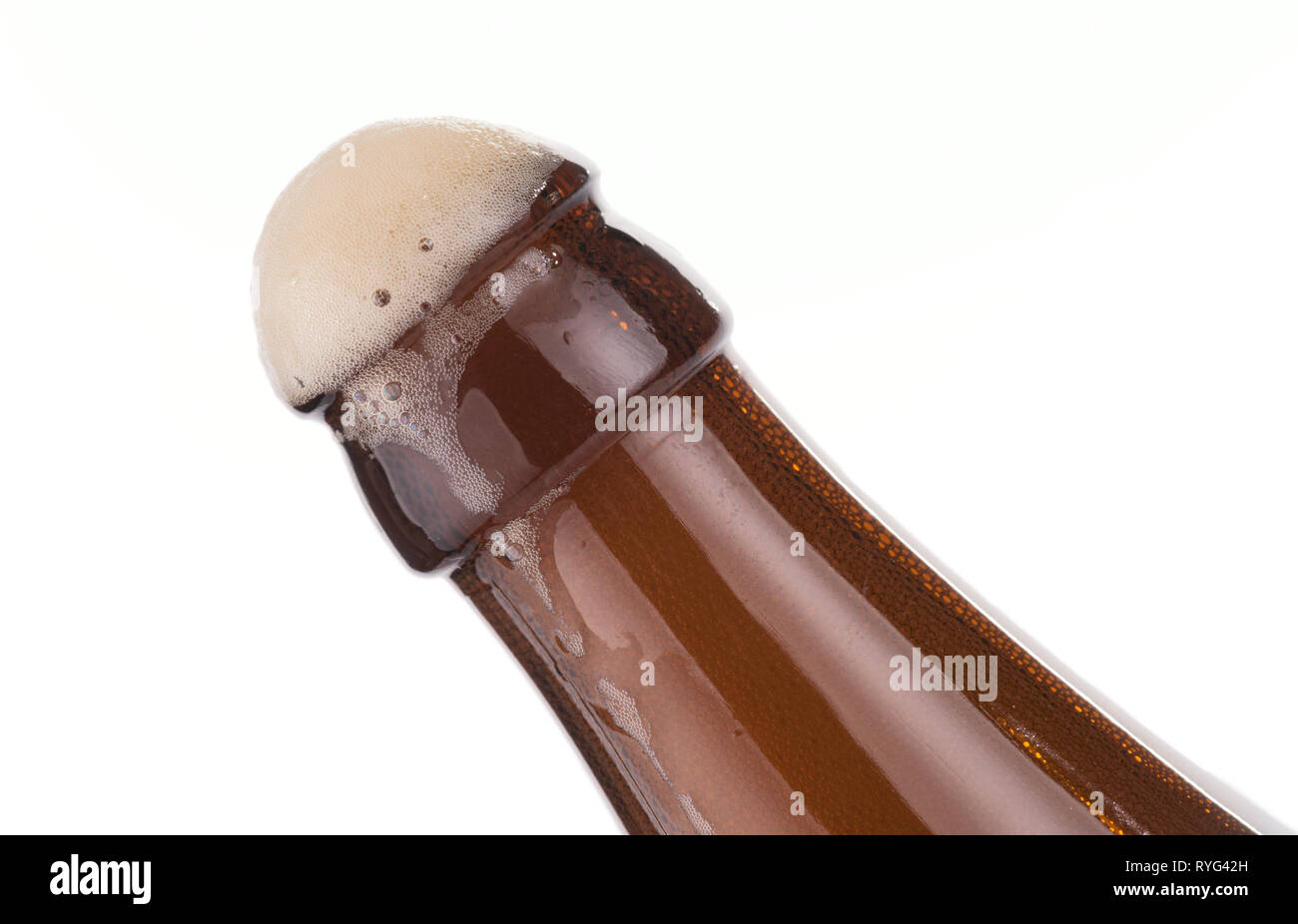 Open beer bottle with froth, isolated on white Stock Photo