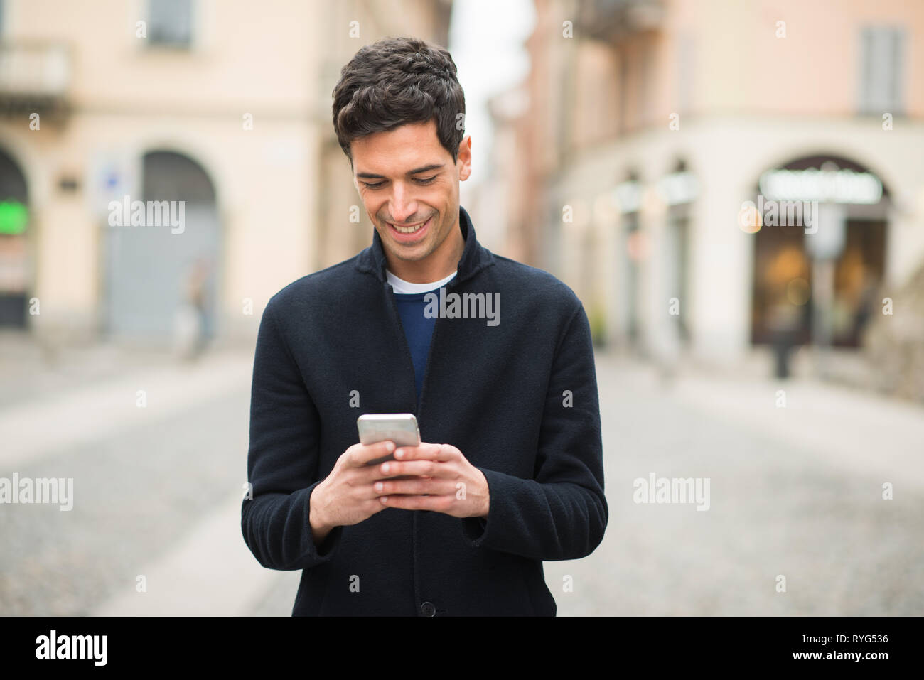 Man using his cell phone Stock Photo - Alamy