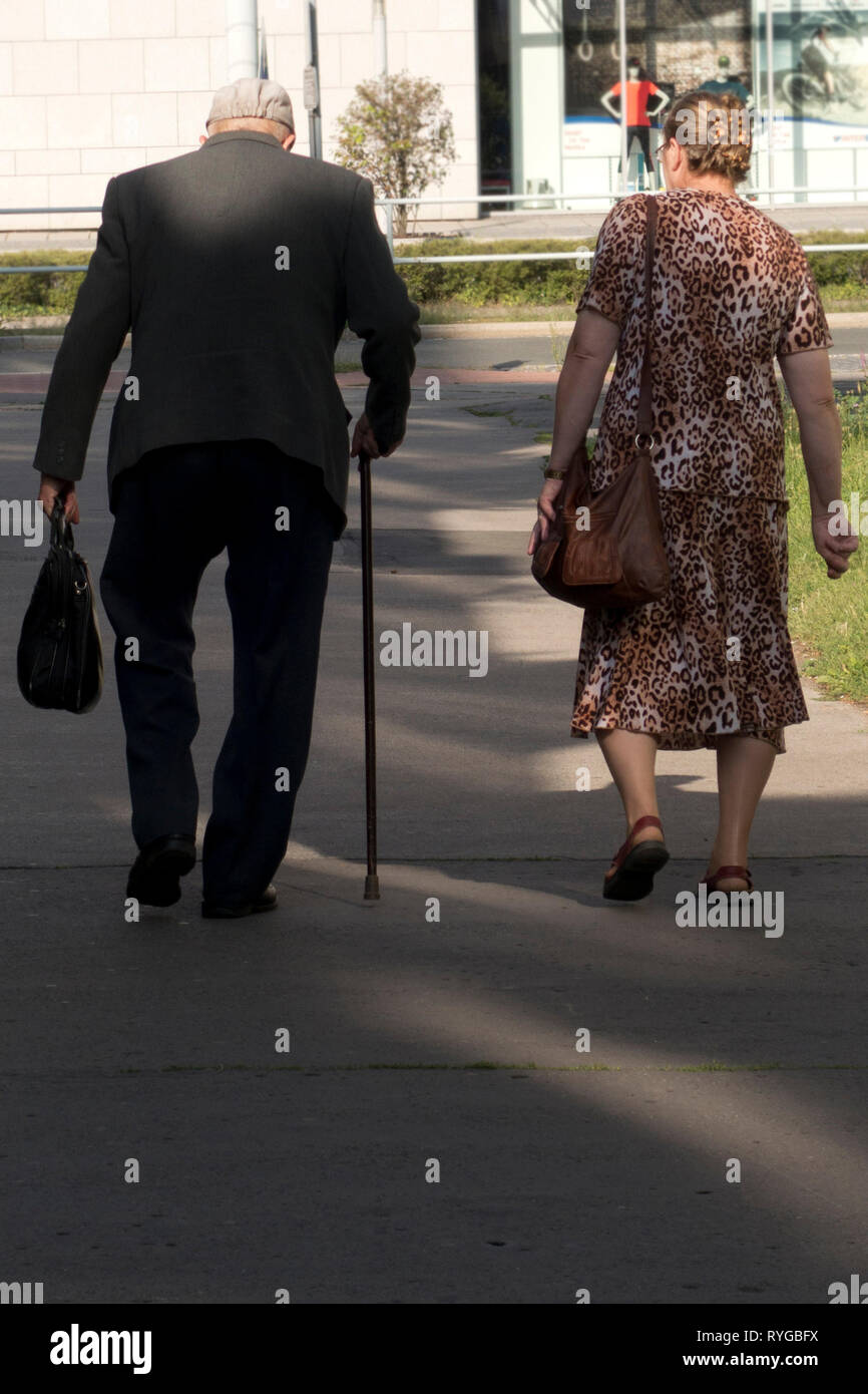Old man with walking stick hi-res stock photography and images - Alamy