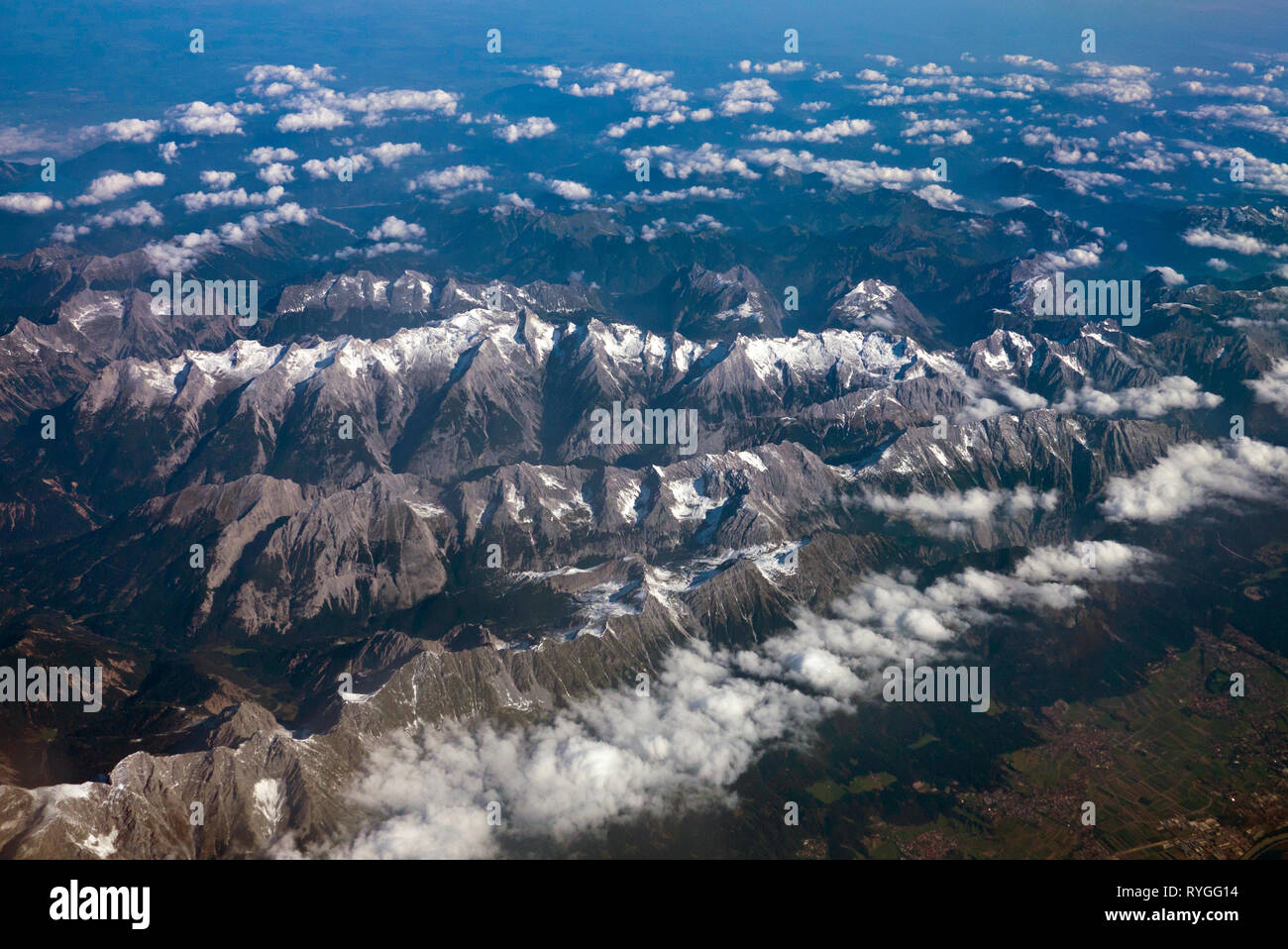 Aerial view of Alps mountains with snow on mountain peaks seen from an ...