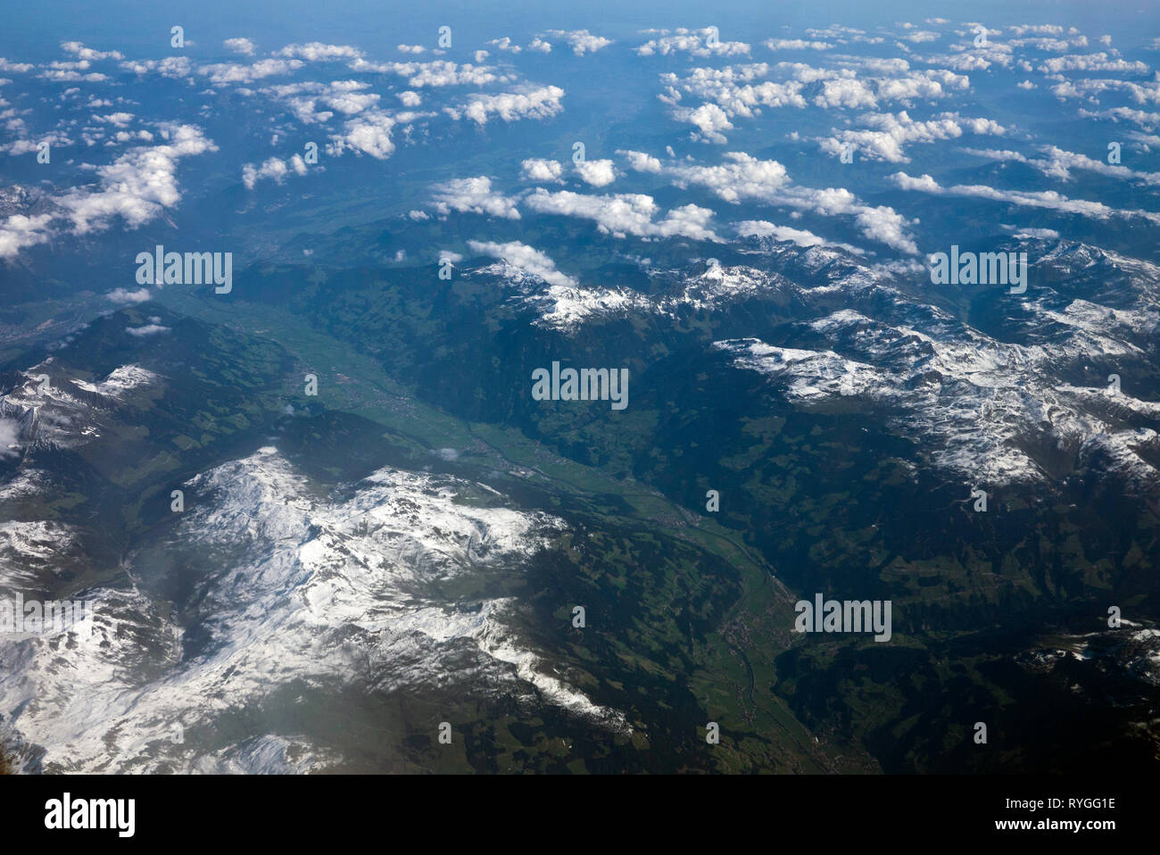 Aerial view of Alps mountains with snow on mountain peaks seen from an ...