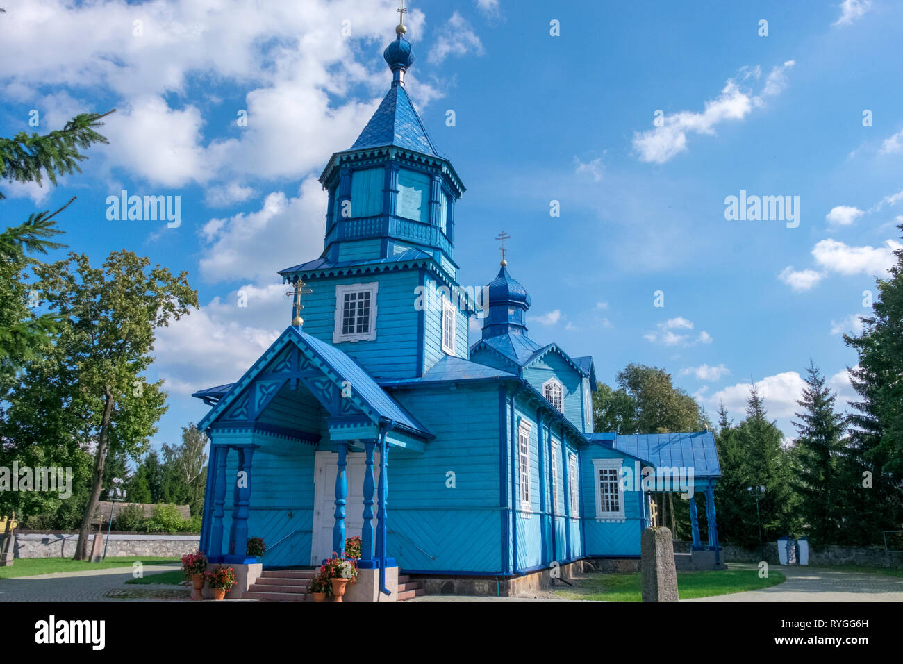 Ruthenian Catholic Church in brilliant blue color with multiple crosses and spires on the border between eastern Poland and western Ukraine Stock Photo