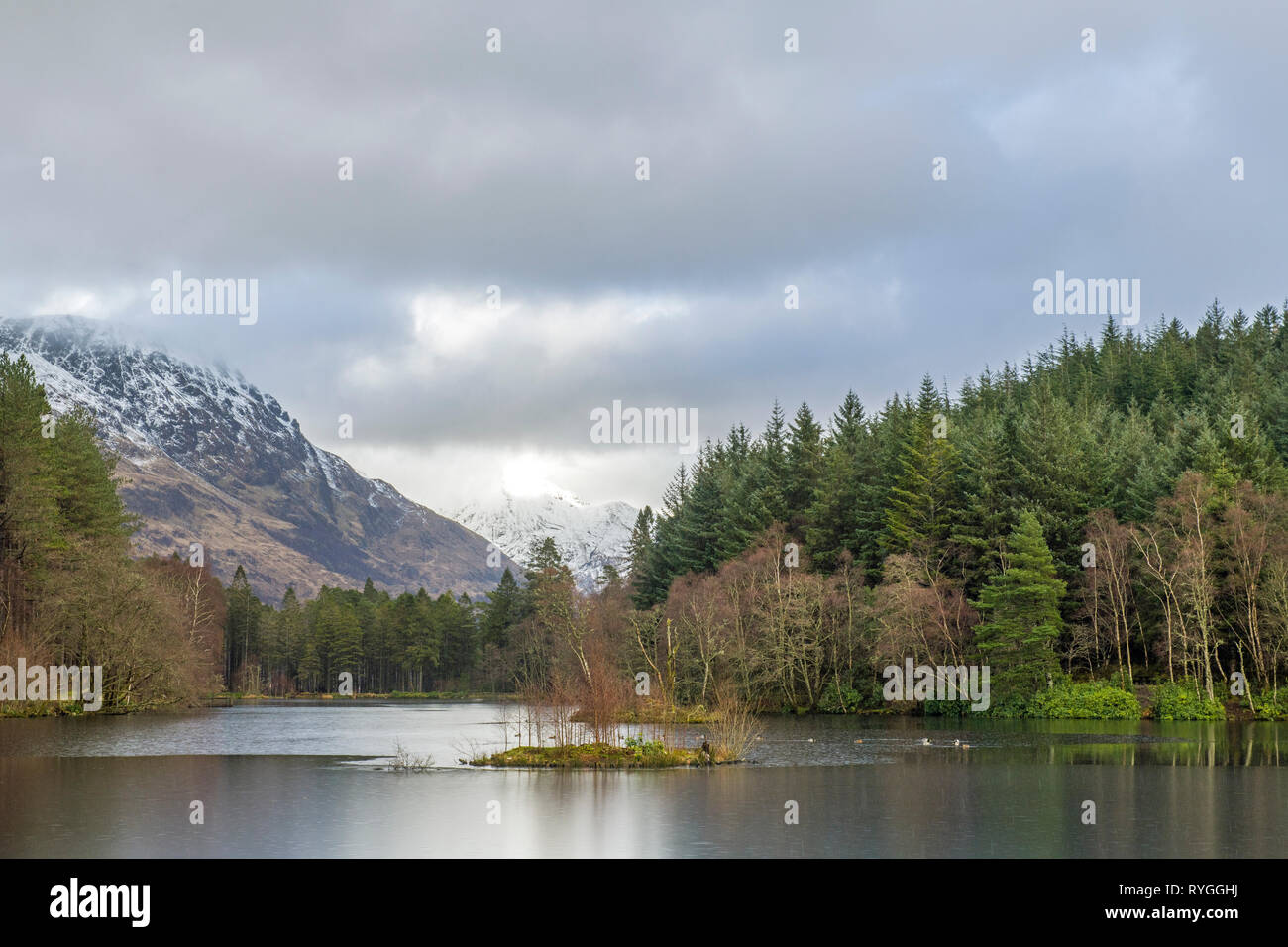 Glencoe Lochan in winter above the village of Glencoe in the Scottish Highlands. Views from the lochan are superb, ao it's very popular with walkers.. Stock Photo