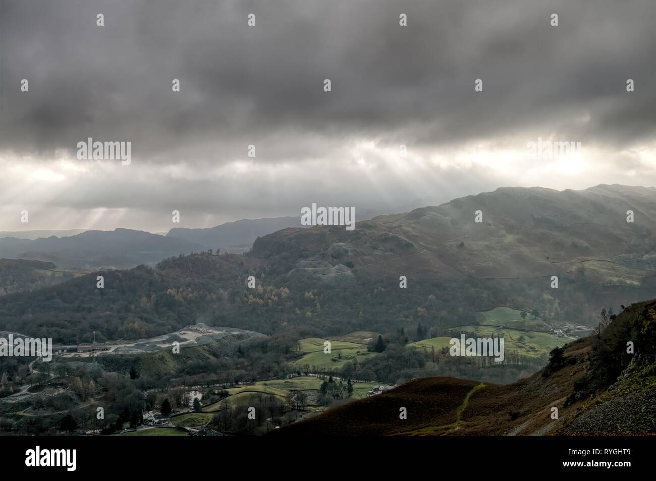 Crepuscular rays and the Great Langdale valley. Stock Photo