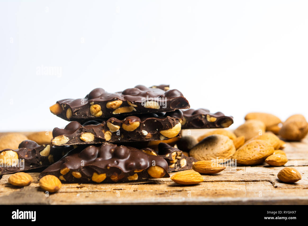 Chocolate pieces with almonds on a table Stock Photo