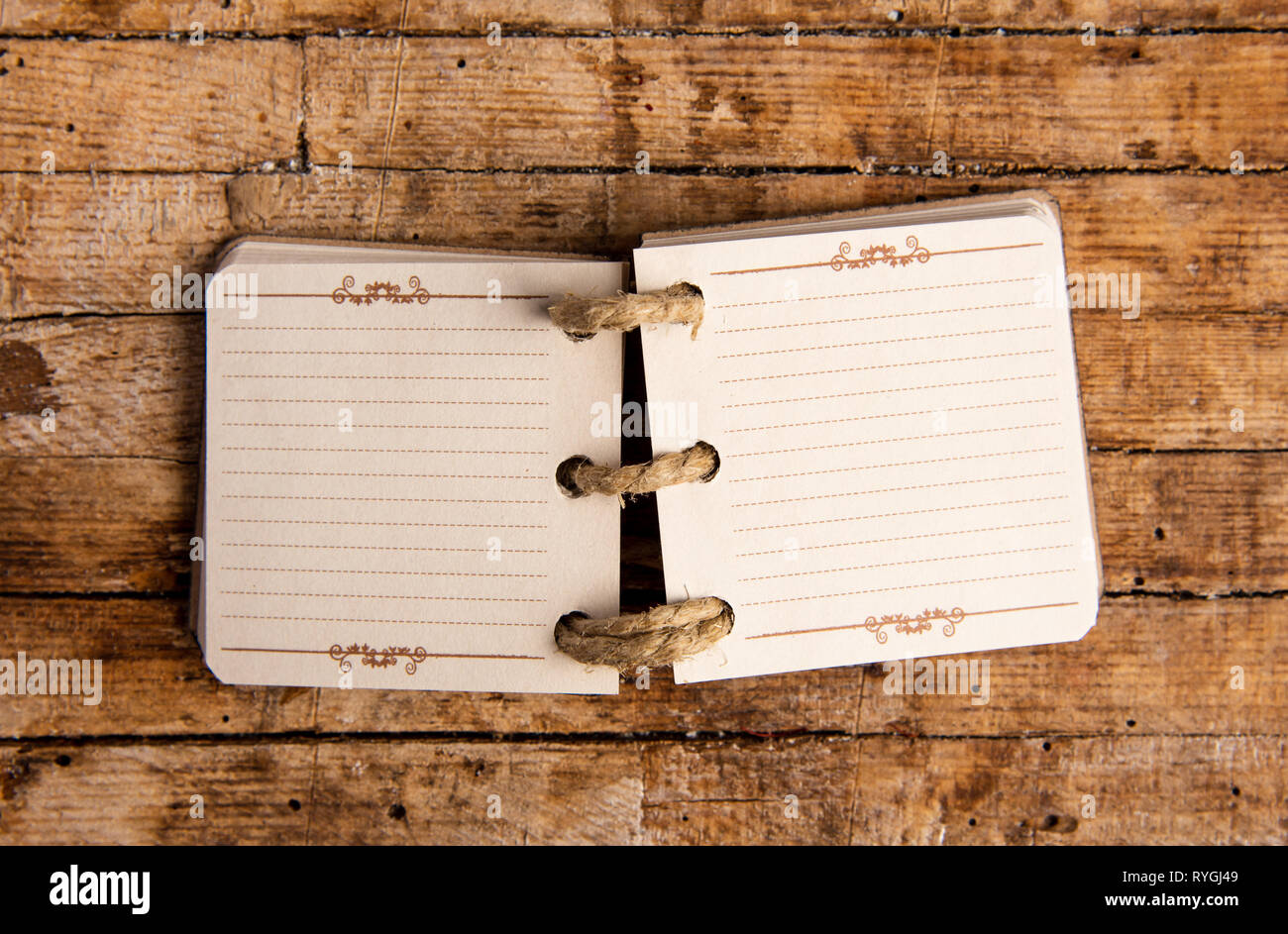 Small open notebook on a table top view Stock Photo