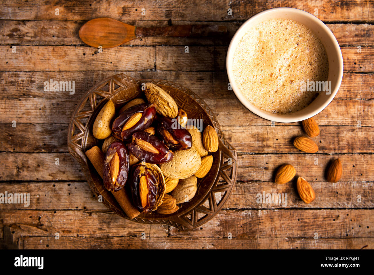 Cup of coffee and snacks on a table top view Stock Photo