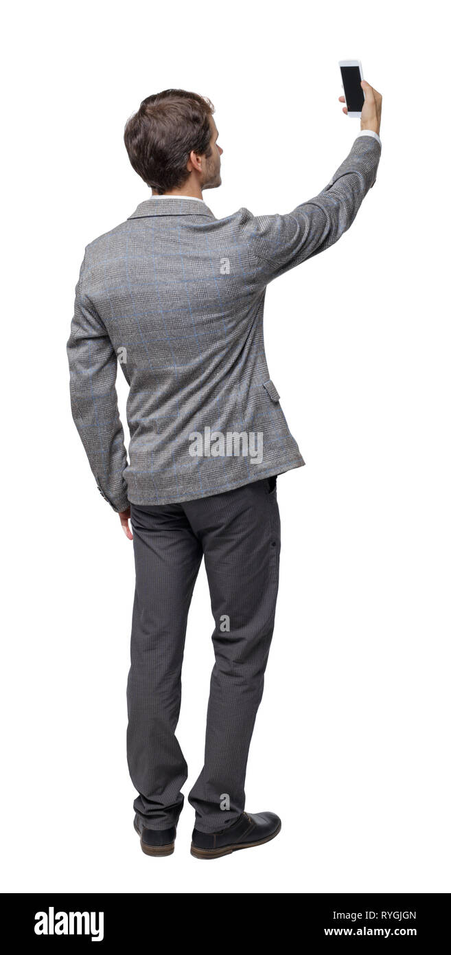 Back view of a businessman in a suit making a selfie. rear view people ...