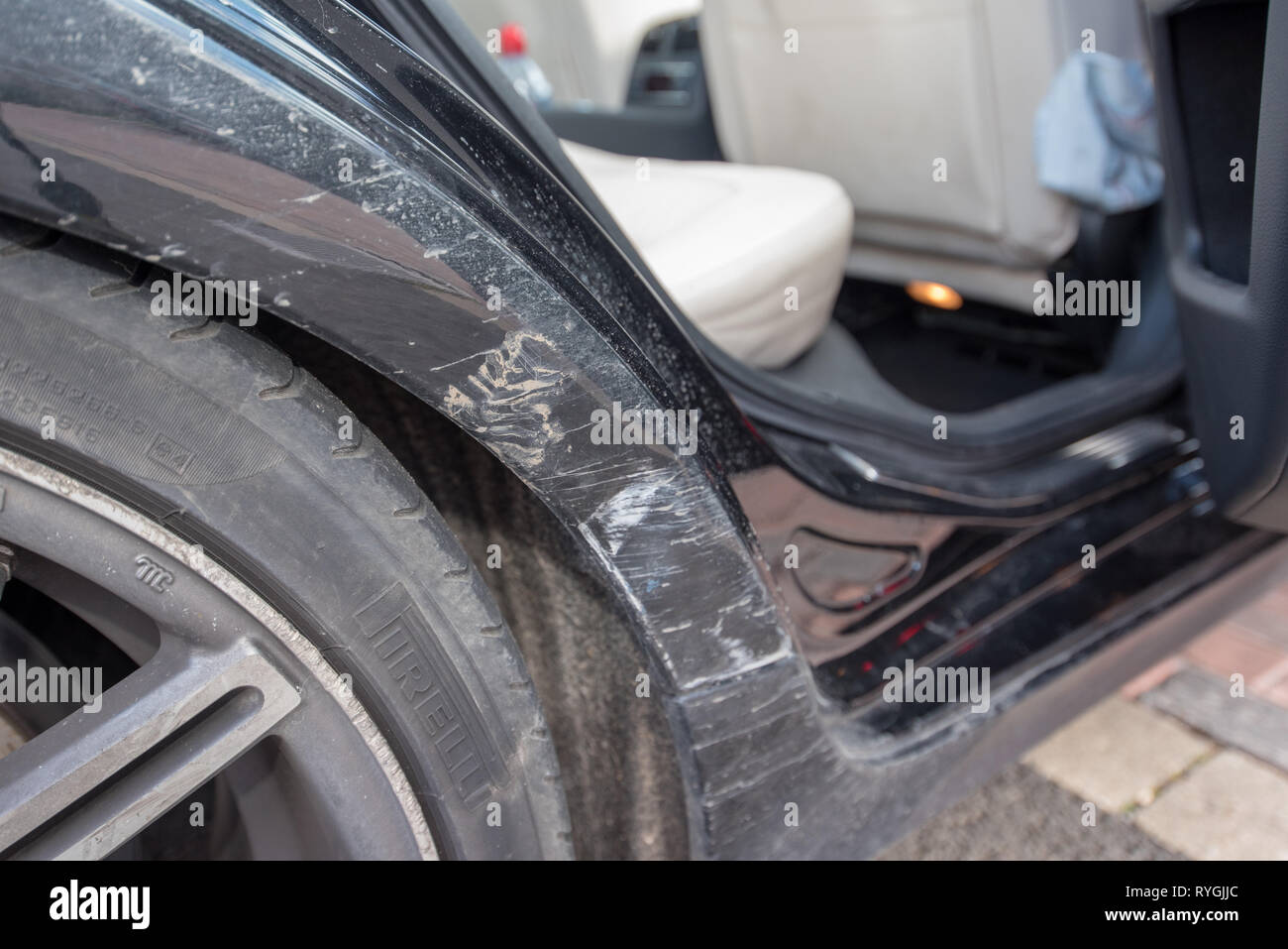 Car crash UK. Close up damage and details after a road traffic accident. Crushed bodywork and tyres. Stock Photo