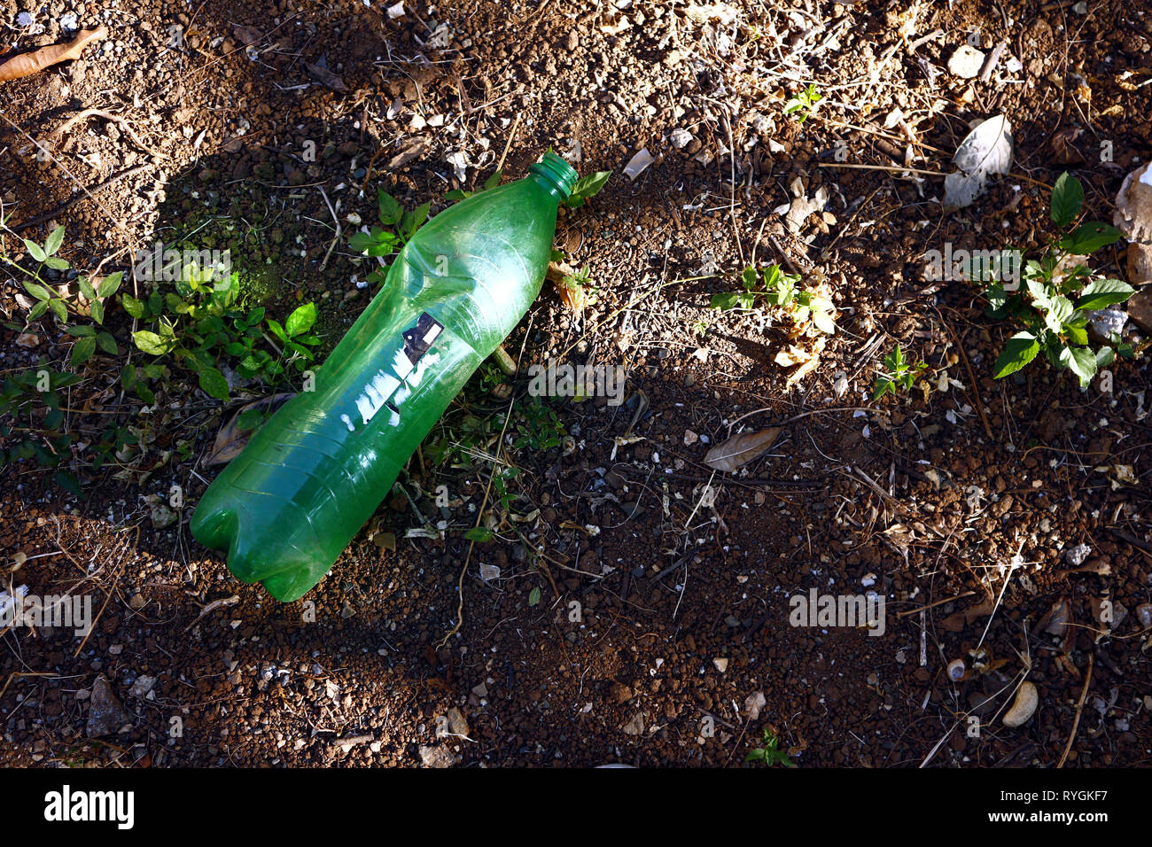 Photo of an empty soda bottle on the ground Stock Photo Alamy