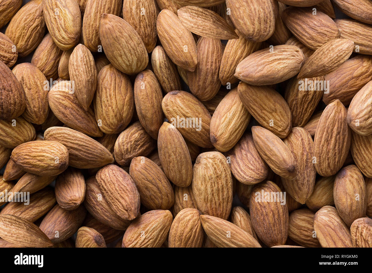 Peeled almond nuts pile top view closeup Stock Photo