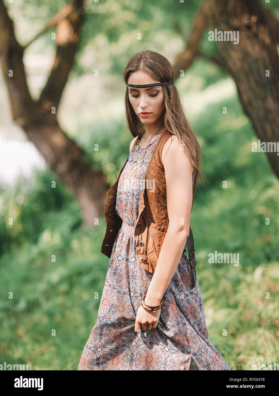 beautiful hippie girl on spring forest background Stock Photo