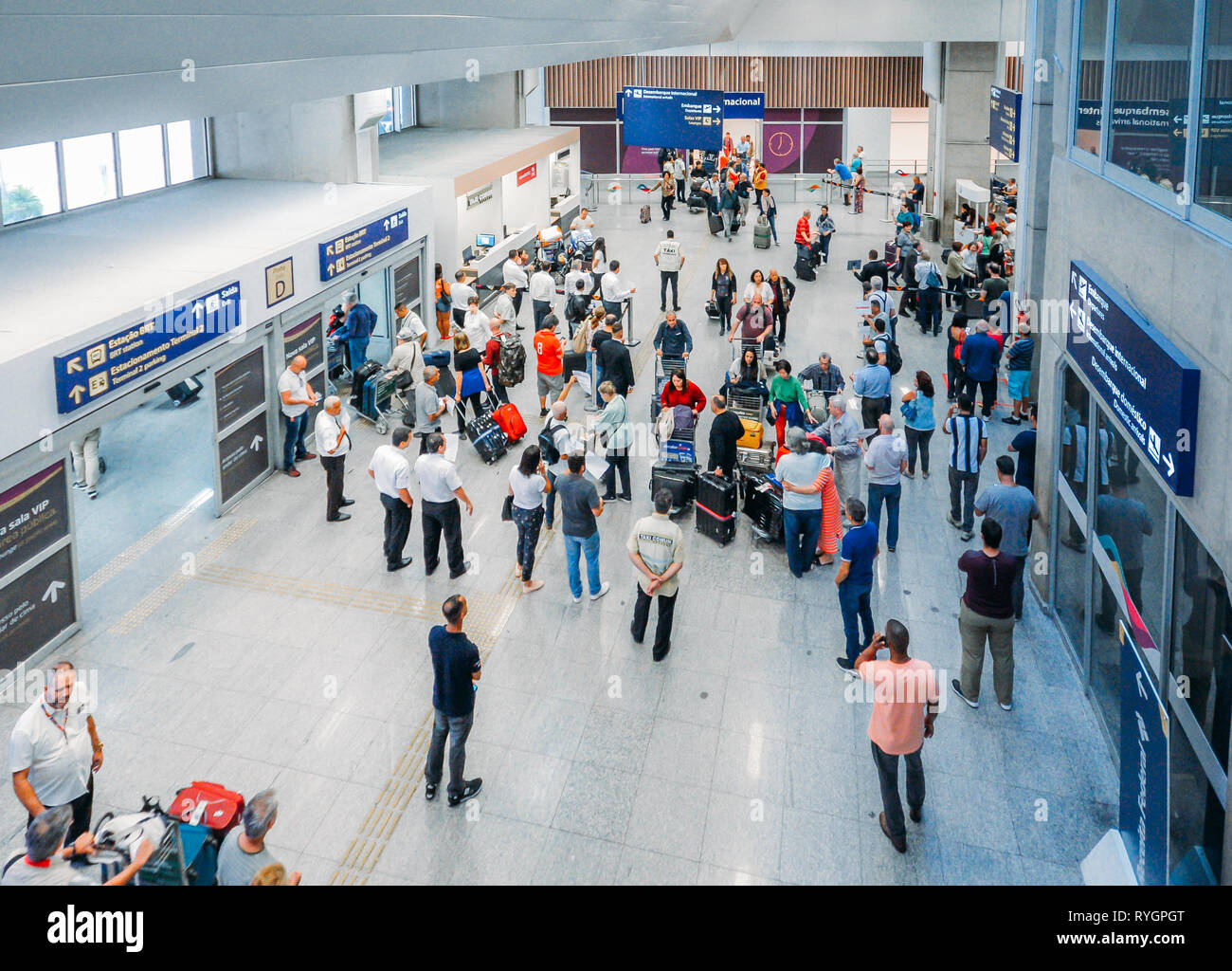 Rio de Janeiro, Brazil - March 13, 2019: Travelers, families and taxi drivers at international arrivals hall at Galeao Rio de Janeiro International Stock Photo
