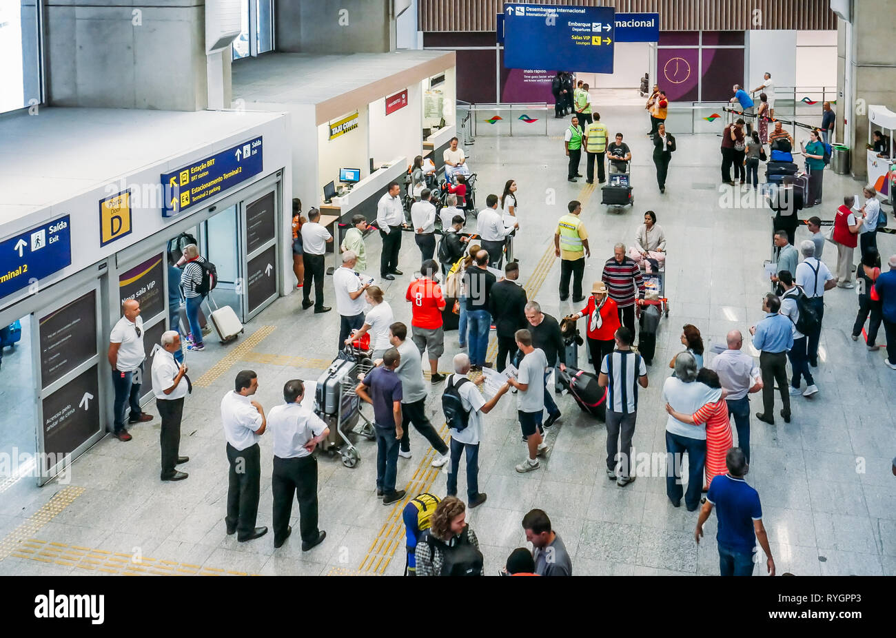 Rio de Janeiro, Brazil - March 13, 2019: Travelers, families and taxi drivers at international arrivals hall at Galeao Rio de Janeiro International Stock Photo
