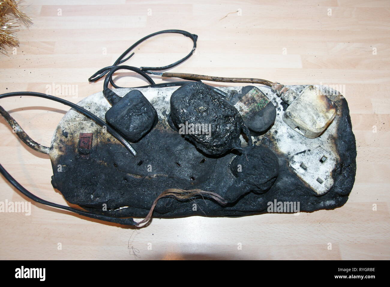 overloaded socket, domestic house fire electrical fire Stock Photo