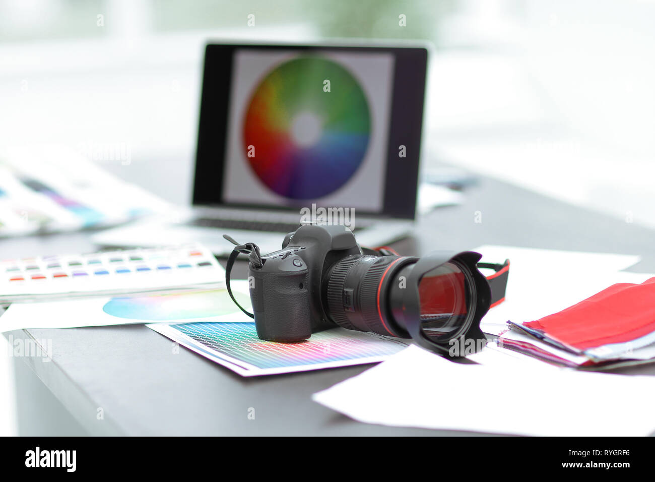 camera,fabric samples and sketches are on the desktop Stock Photo - Alamy