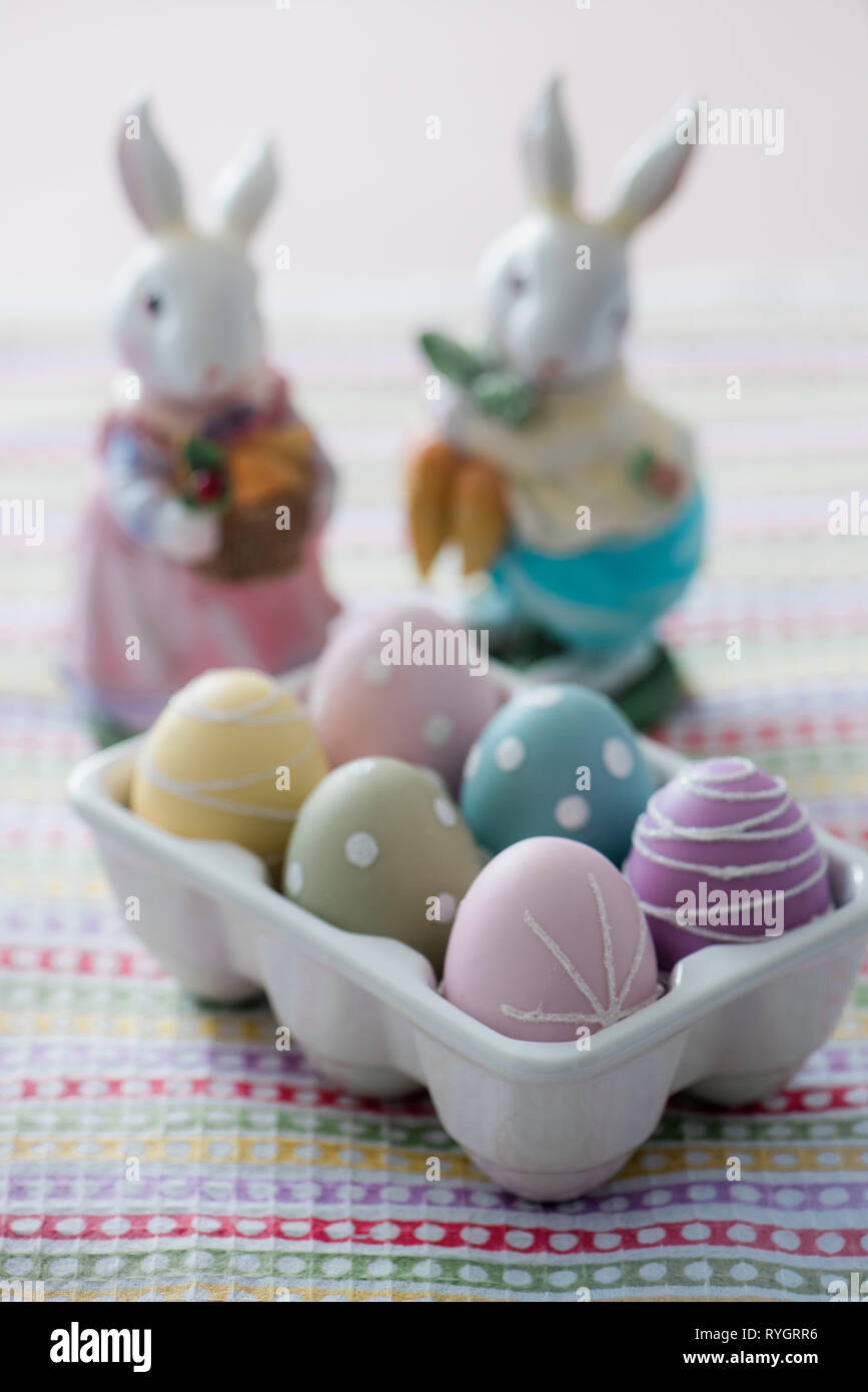 Dyed Easter eggs with toy rabbit Stock Photo