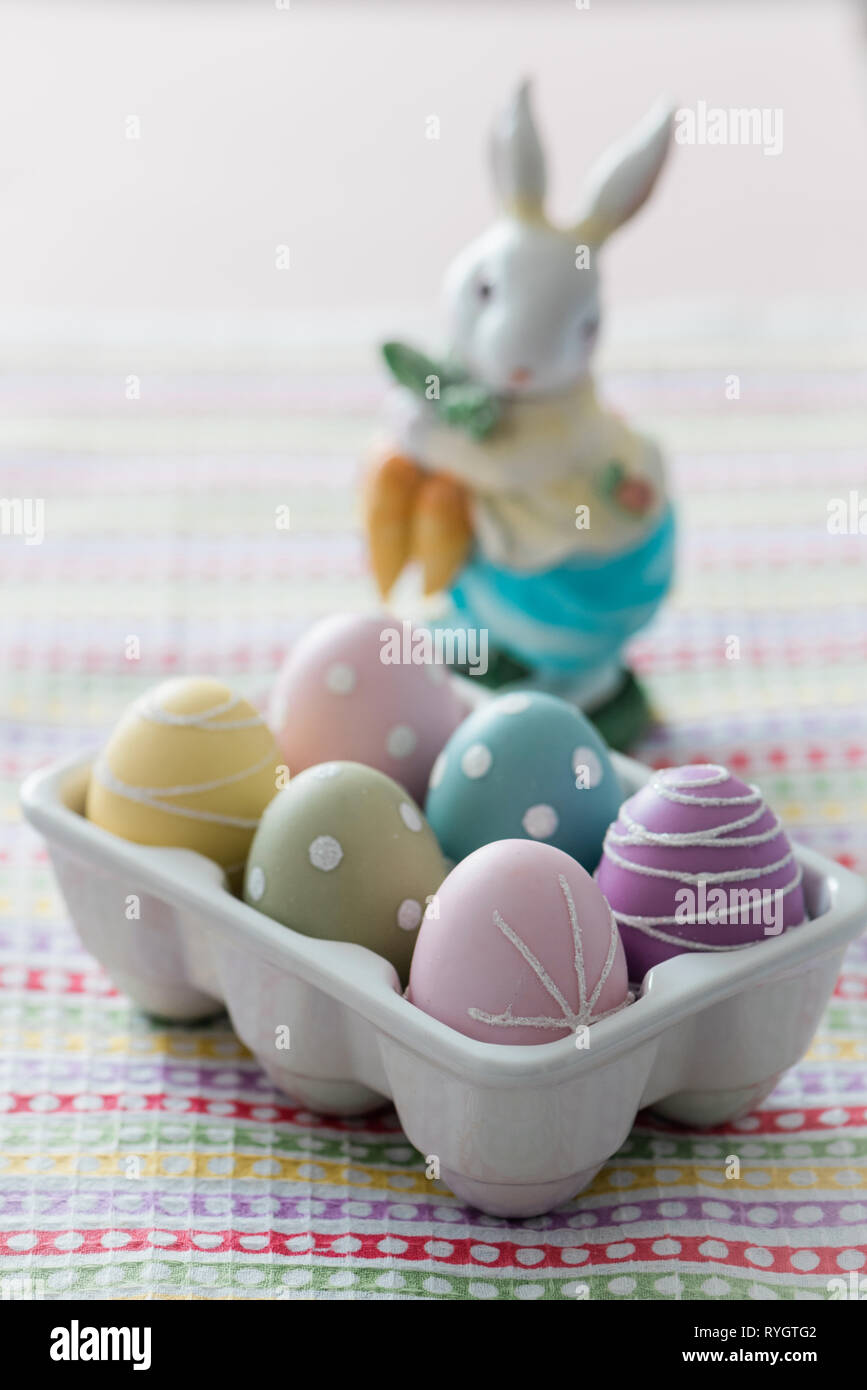 Dyed Easter eggs with toy rabbit Stock Photo
