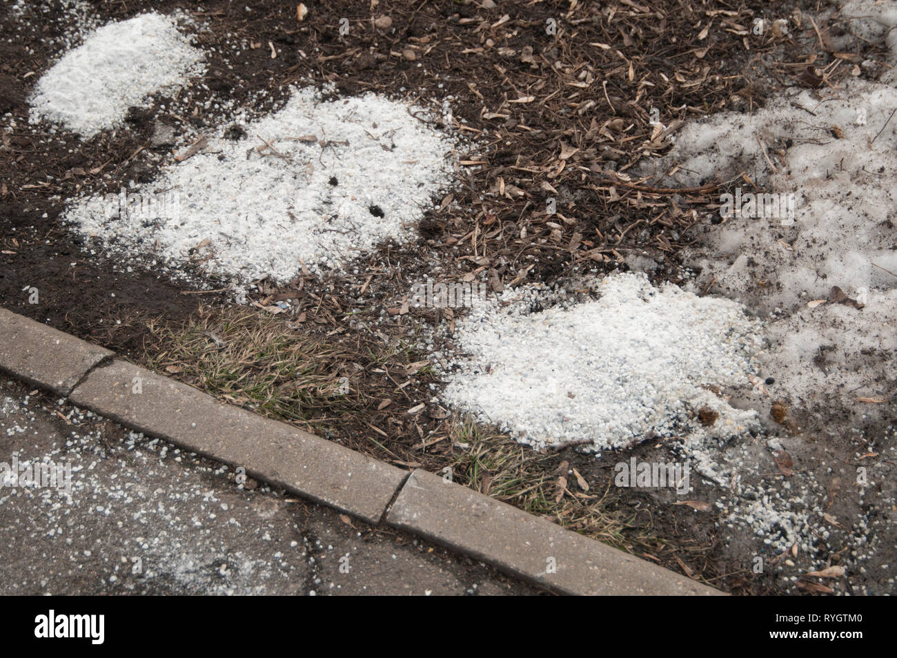 Deicing chemicals near asphalt road in Moscow Stock Photo - Alamy