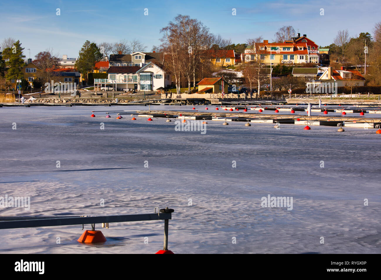 Houses and frozen harbour in Sigtuna the oldest town in Sweden, Scandinavia Stock Photo