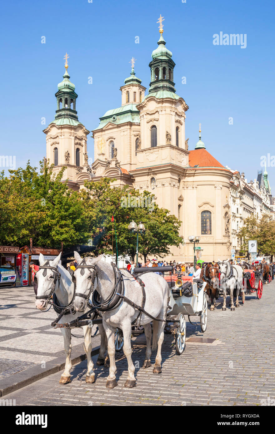 PRAGUE Old town square Prague carriage rides outside St Nicholas' church Prague CZECH REPLUBLIC EU EUROPE Stock Photo