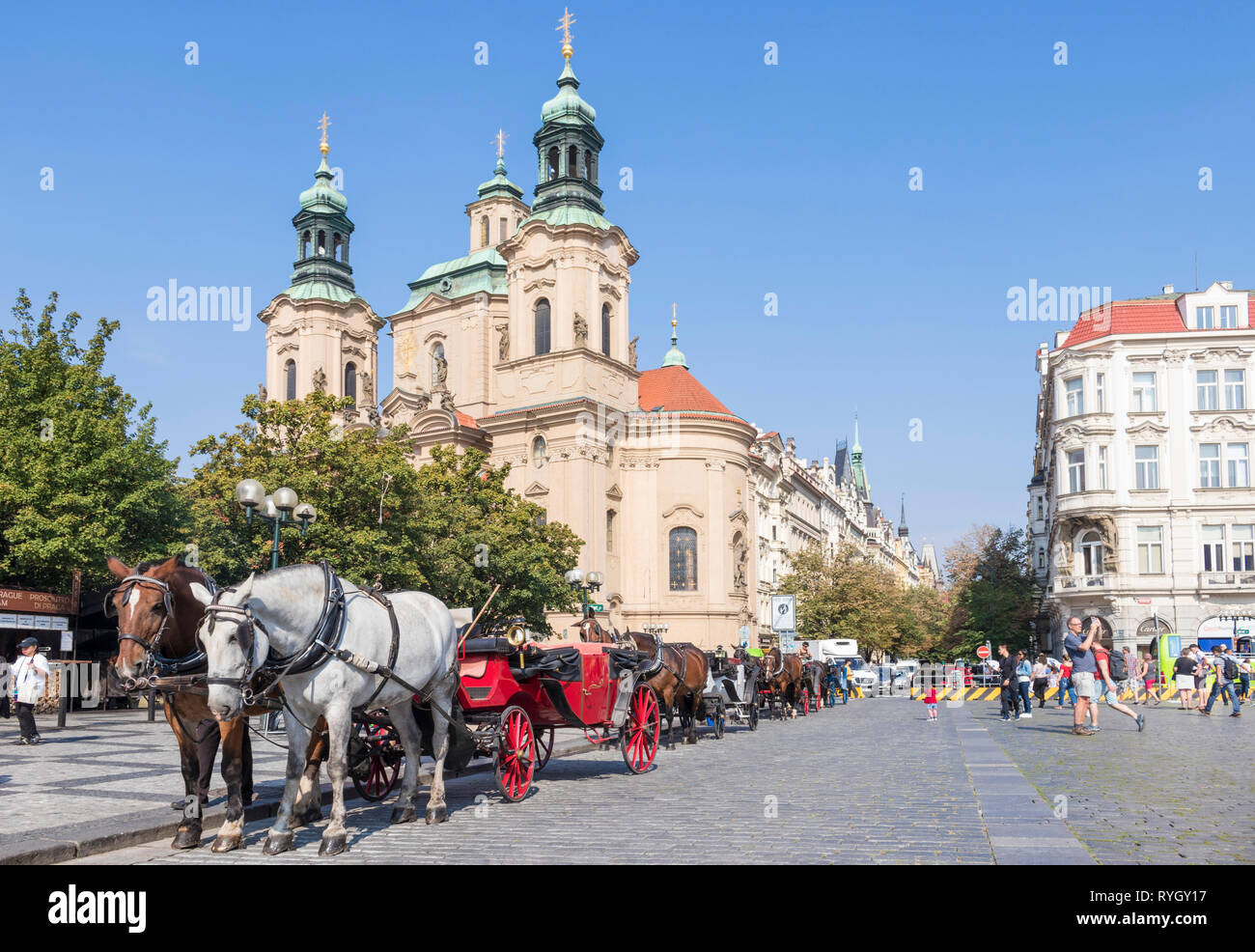 PRAGUE Old town square Prague carriage rides outside St Nicholas' church Prague CZECH REPLUBLIC EU EUROPE Stock Photo